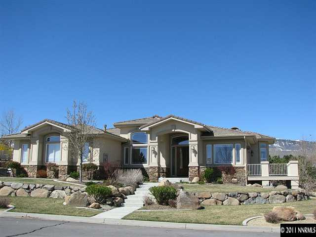 135 Gazelle Road Reno, NV 89511 - Photo 1 of 13 a front view of a house with a yard