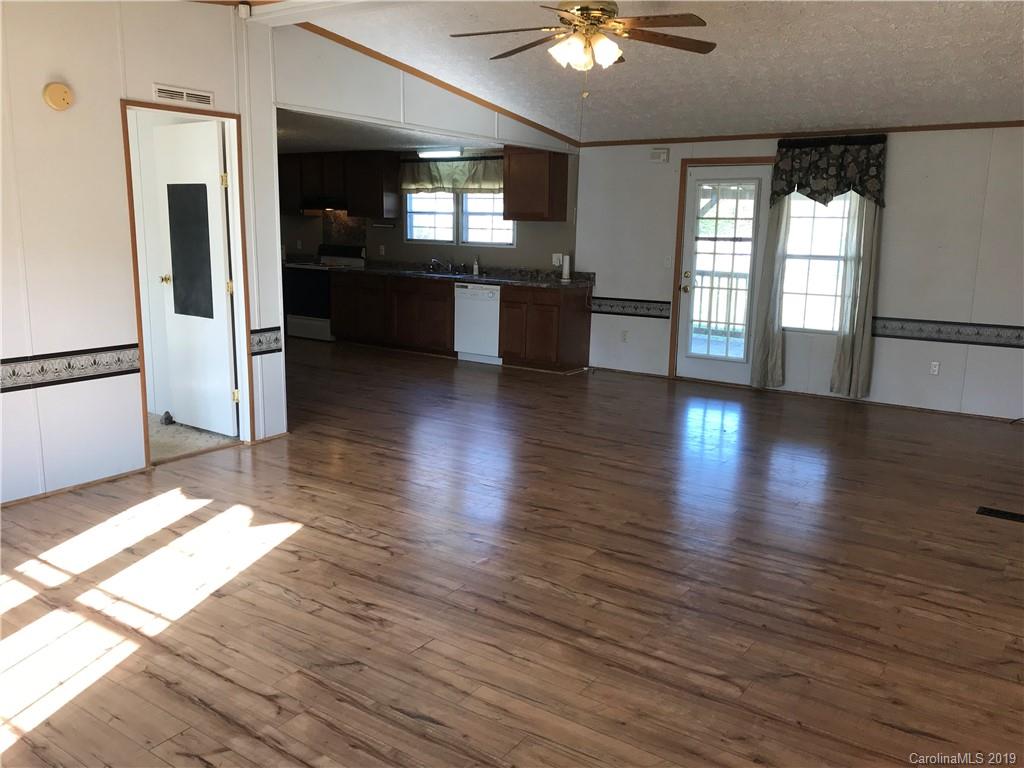 124 Fair Share Road Salisbury, NC 28147 - Photo 2 of 33 a view of a living room with hardwood floor and a window