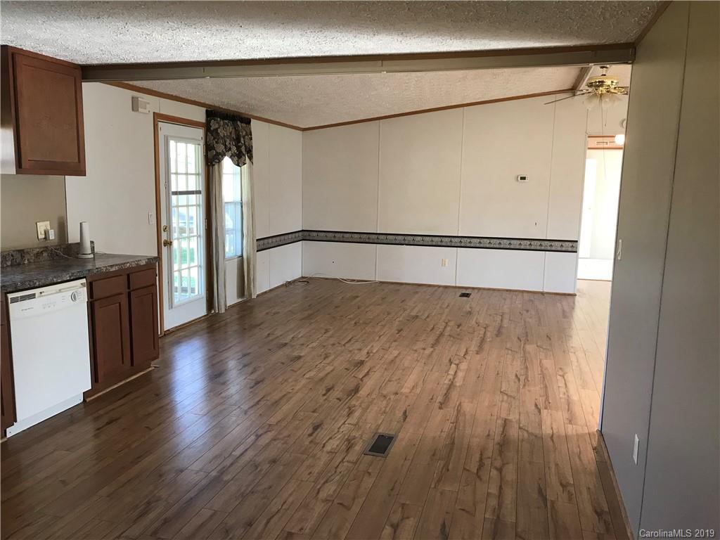 124 Fair Share Road Salisbury, NC 28147 - Photo 14 of 33 a view of a kitchen with wooden floor and a window