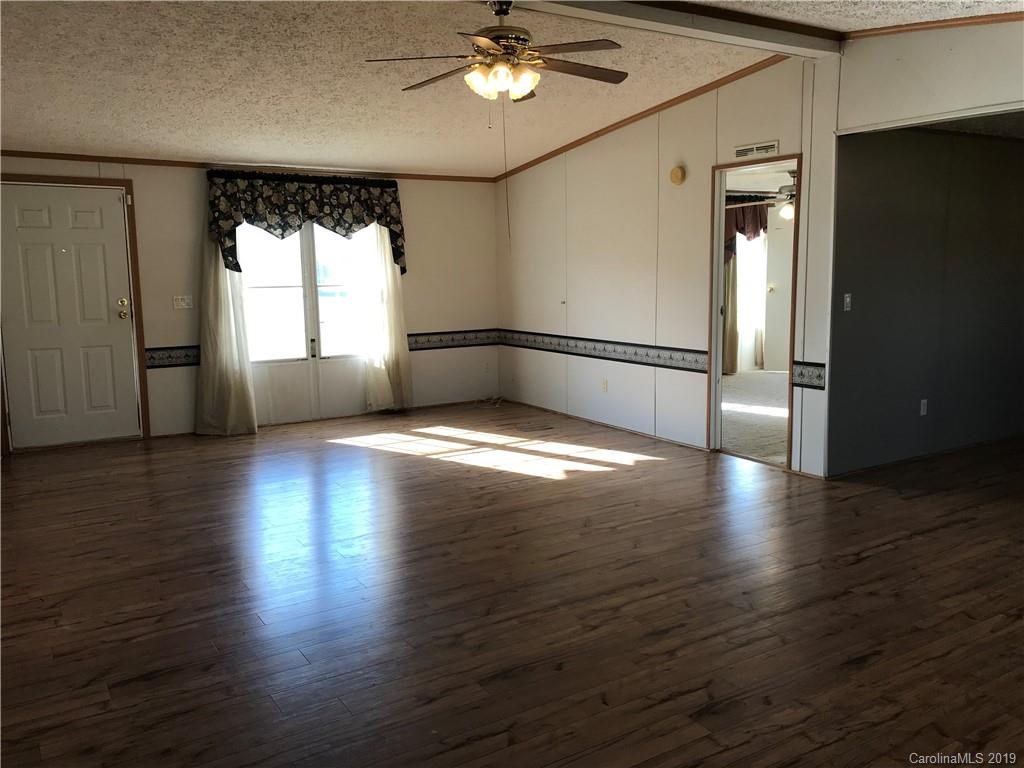 124 Fair Share Road Salisbury, NC 28147 - Photo 24 of 33 a view of empty room with wooden floor and fan