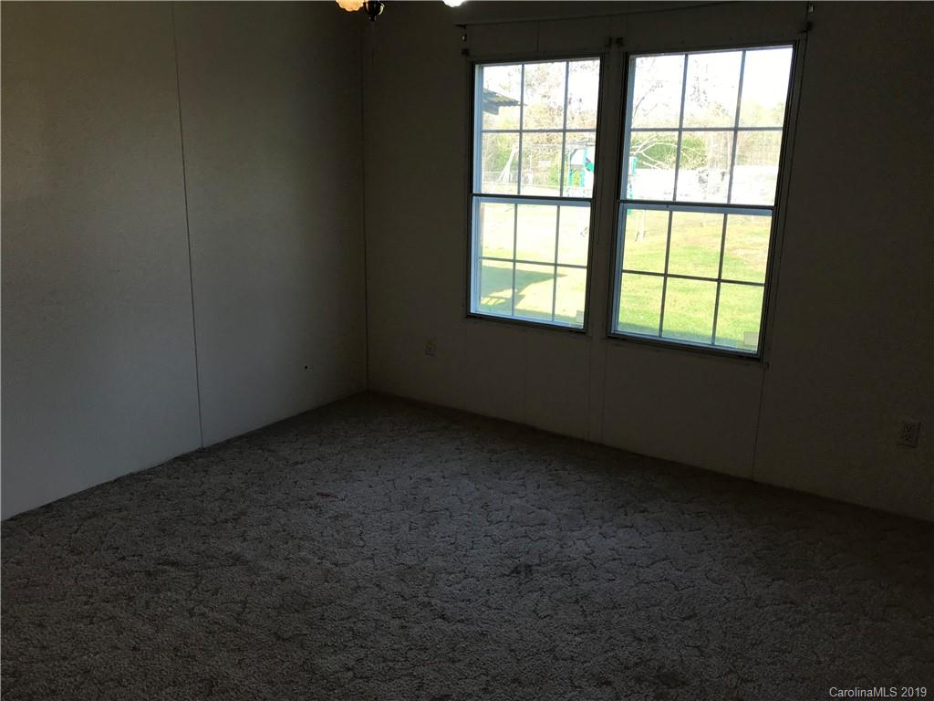 124 Fair Share Road Salisbury, NC 28147 - Photo 26 of 33 an empty room with a window