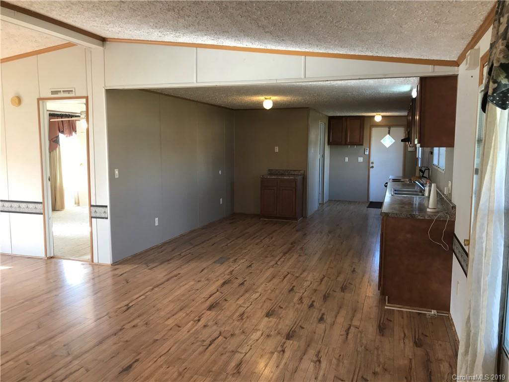 124 Fair Share Road Salisbury, NC 28147 - Photo 8 of 33 a view of a hallway with wooden floor