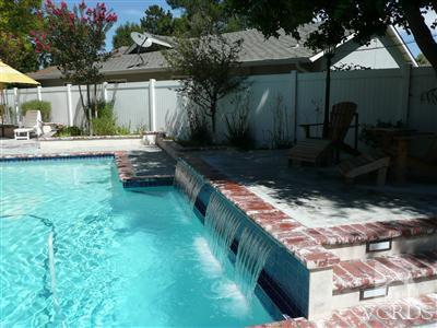 1142 Hendrix Avenue Thousand Oaks, CA 91360 - Photo 2 of 10 a front view of a house with garden
