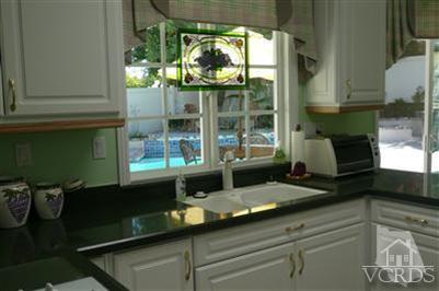 1142 Hendrix Avenue Thousand Oaks, CA 91360 - Photo 5 of 10 a kitchen with a sink and large window