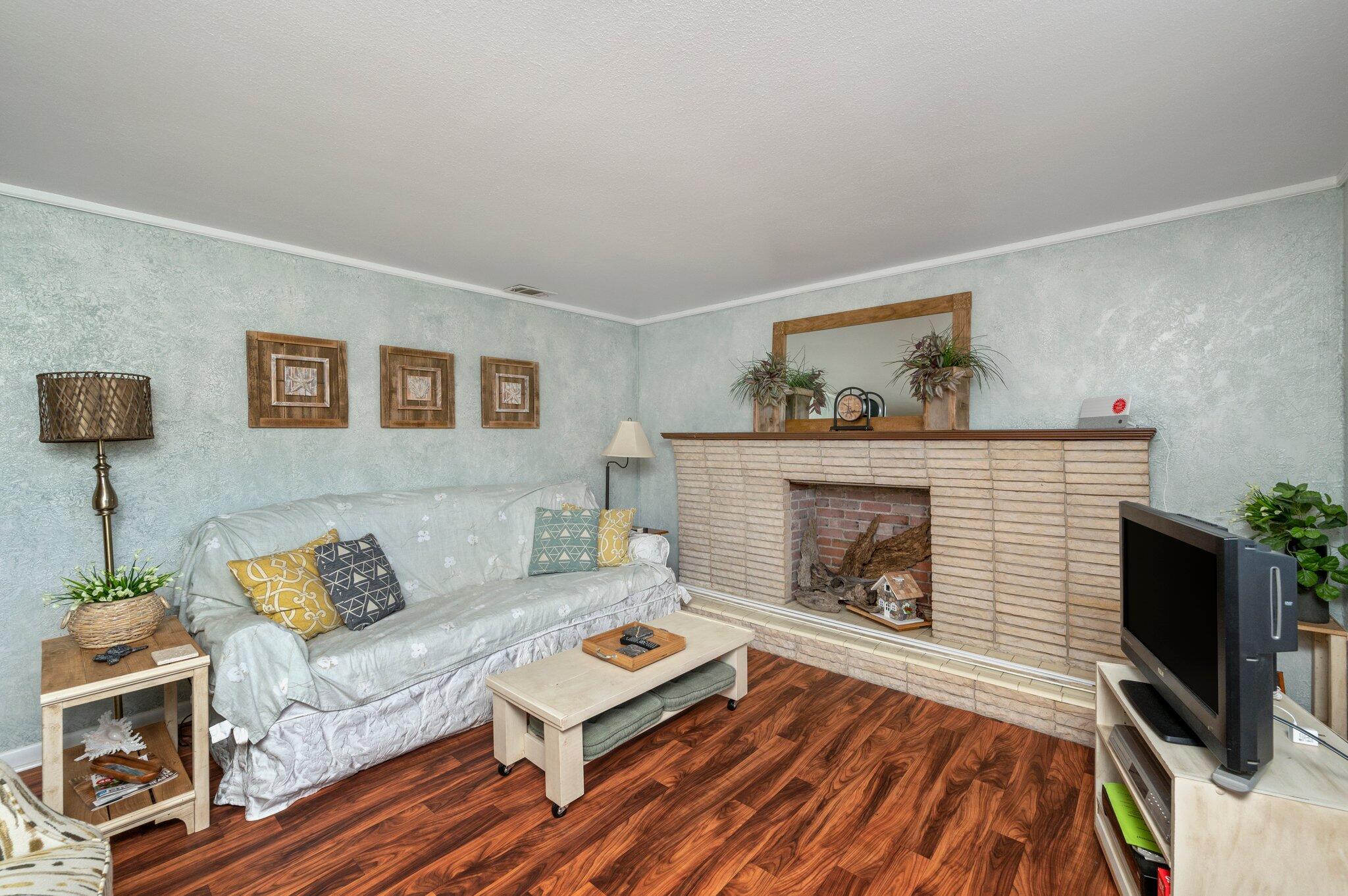 7068 Old River Road Baker, FL 32531 - Photo 18 of 42 a living room with furniture and a fireplace