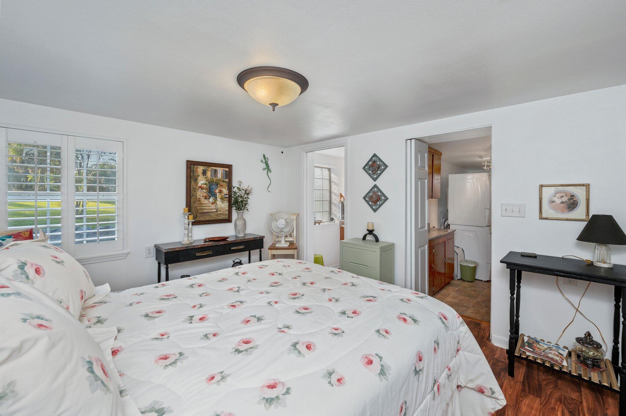 7068 Old River Road Baker, FL 32531 - Photo 21 of 42 a bedroom with a bed and a table in it
