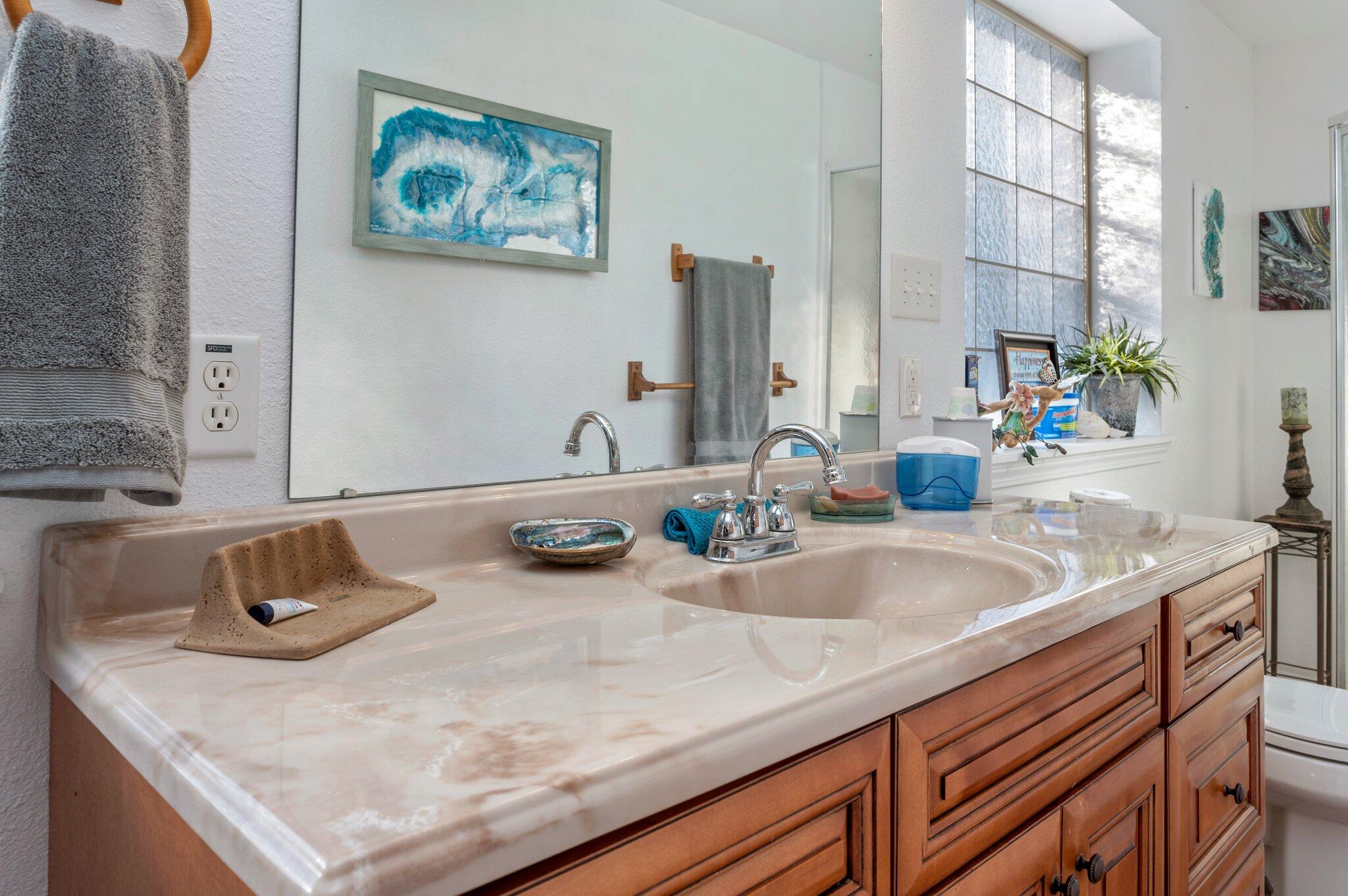 7068 Old River Road Baker, FL 32531 - Photo 22 of 42 a bathroom with a granite countertop sink and a large mirror