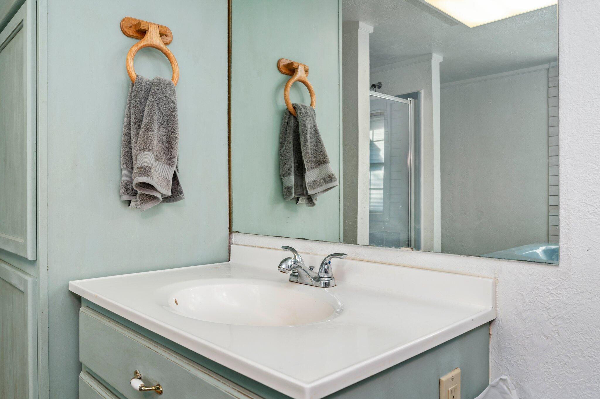 7068 Old River Road Baker, FL 32531 - Photo 30 of 42 a bathroom with a sink vanity and a mirror