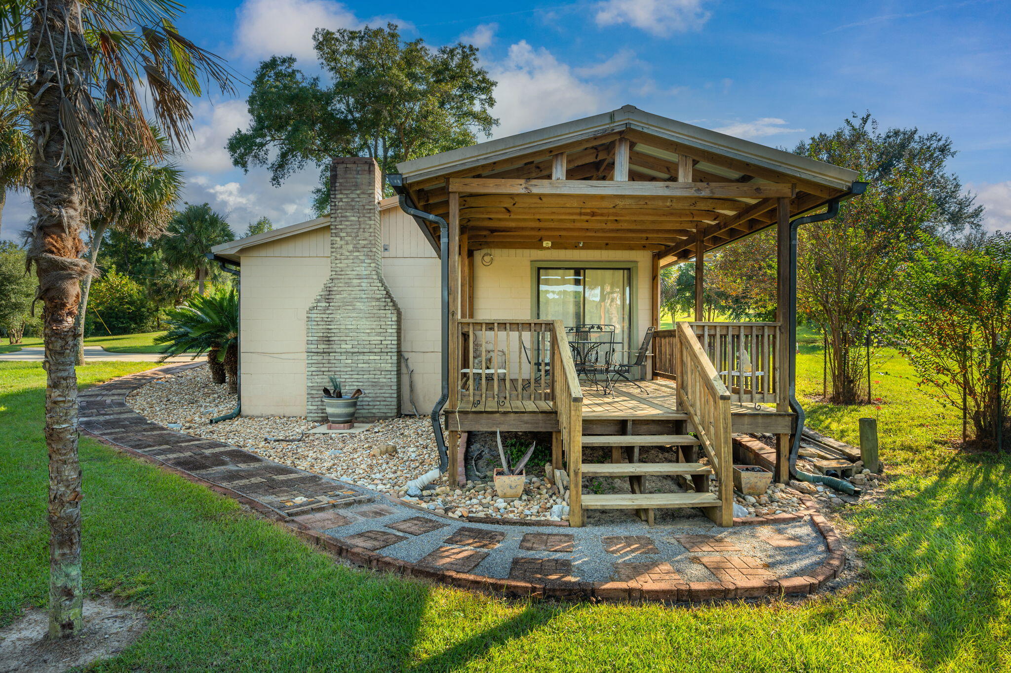 7068 Old River Road Baker, FL 32531 - Photo 33 of 42 a front view of a house with a yard