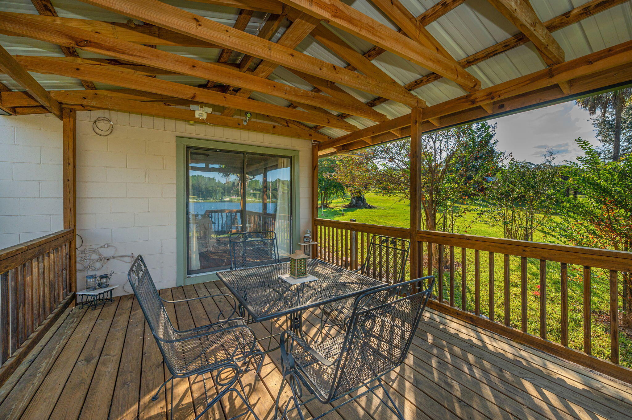 7068 Old River Road Baker, FL 32531 - Photo 34 of 42 a view of balcony with wooden floor