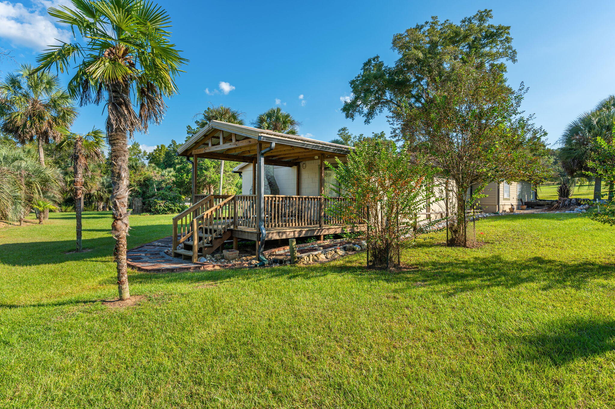 7068 Old River Road Baker, FL 32531 - Photo 36 of 42 a view of a house with a yard