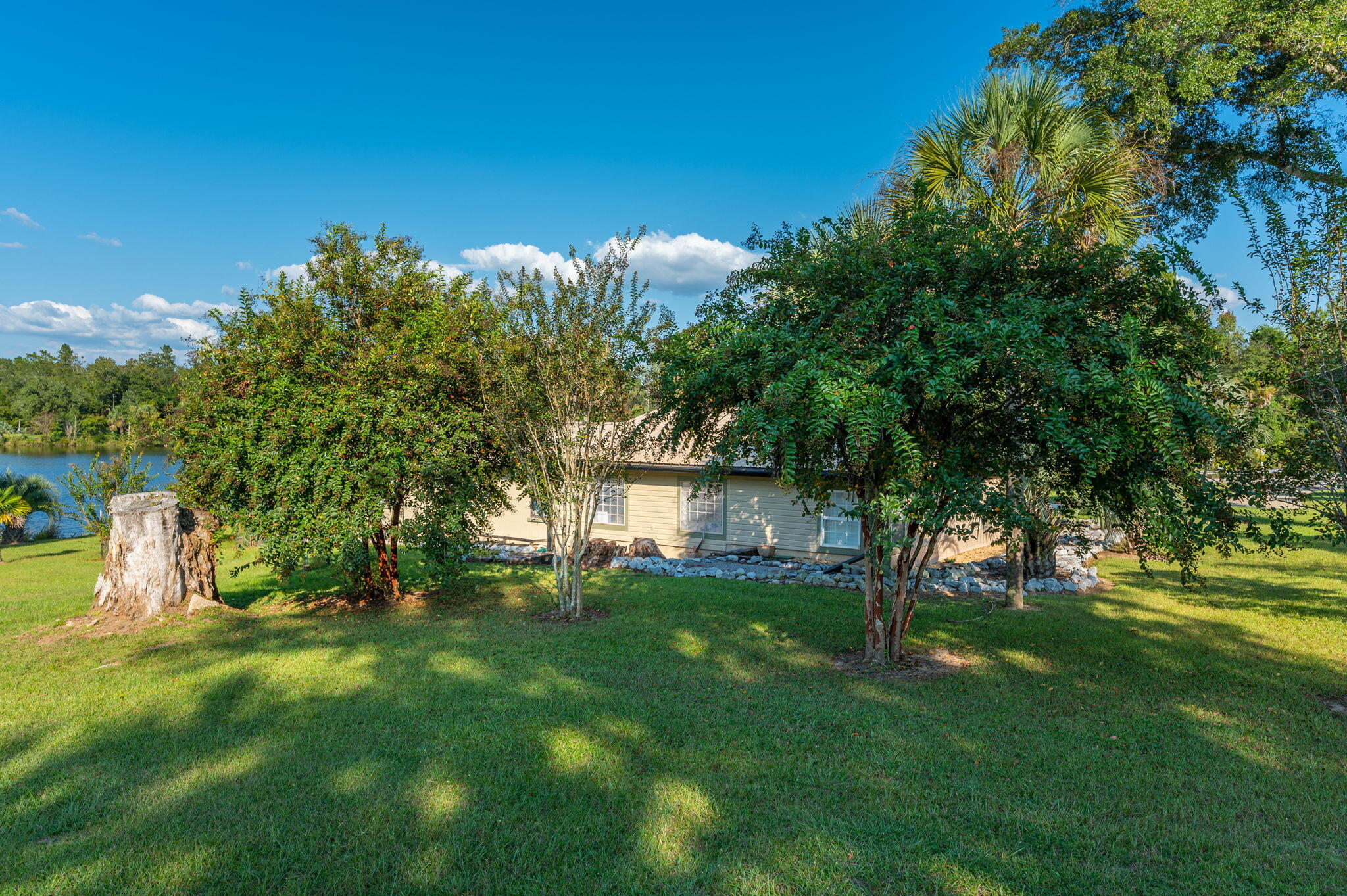 7068 Old River Road Baker, FL 32531 - Photo 38 of 42 a view of a house with a yard