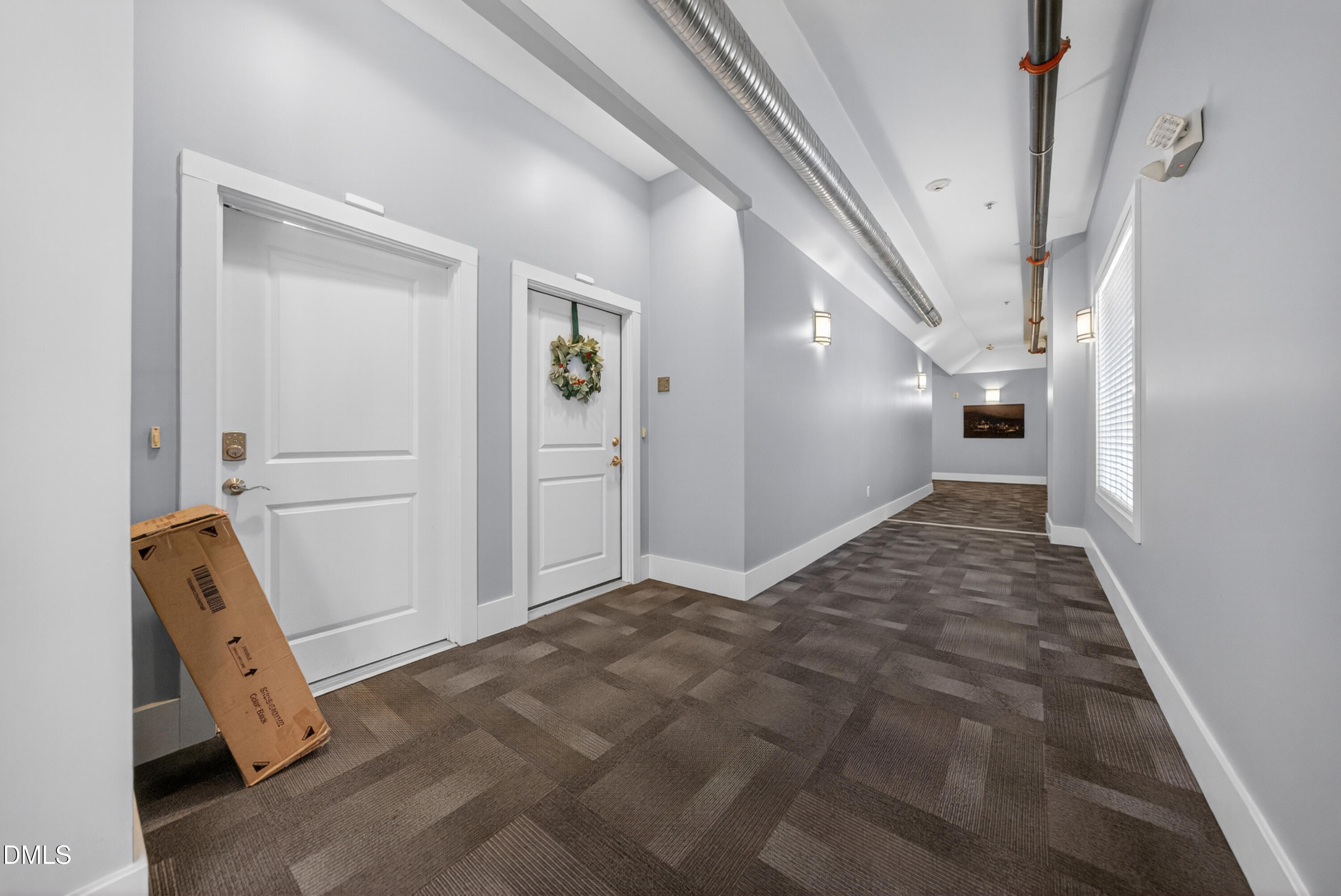 444 South Blount Street, Unit 111 Raleigh, NC 27601 - Photo 29 of 40 a view of a hallway to rooms