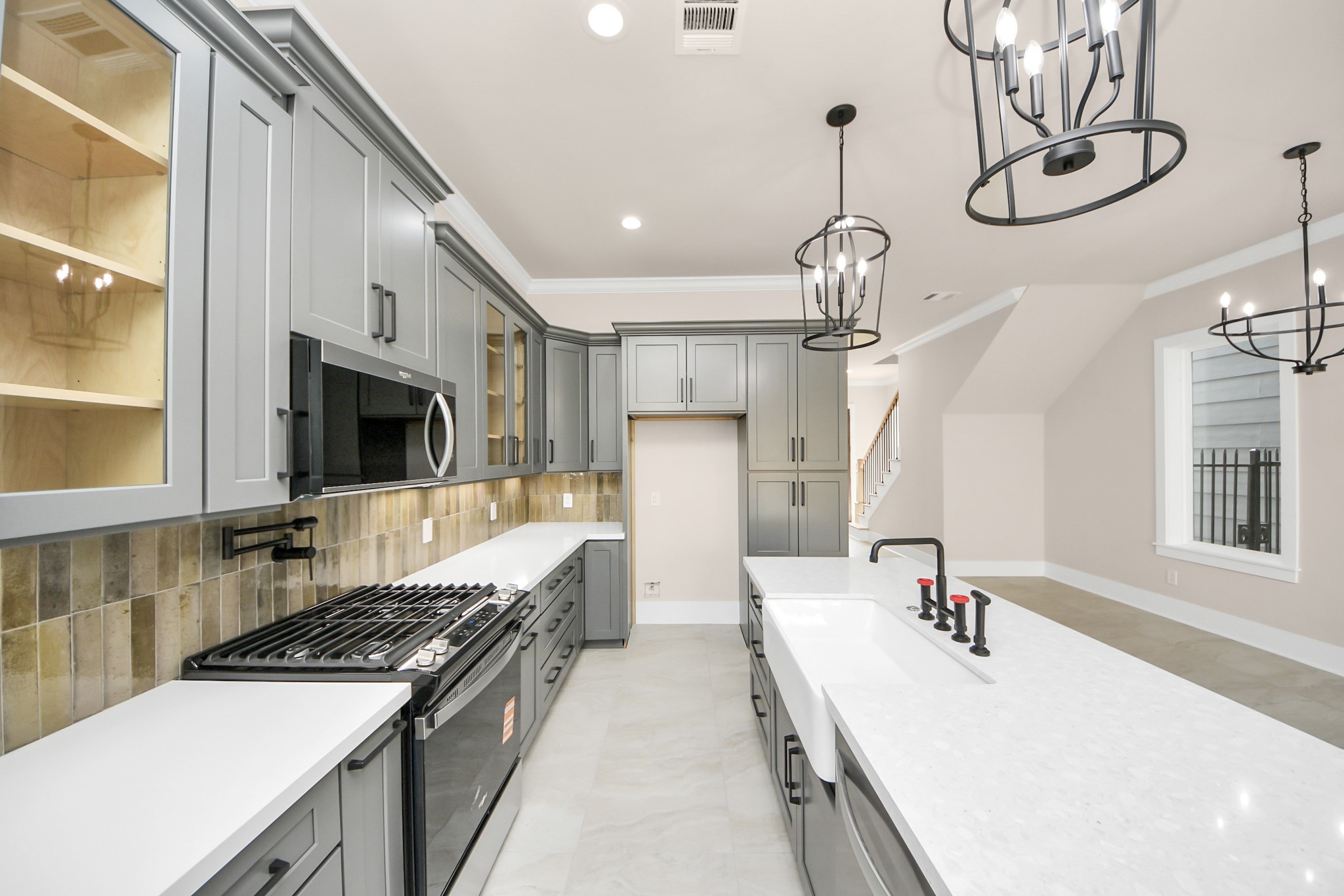6320 Milwee Street, Unit A Houston, TX 77092 - Photo 15 of 42 a kitchen with stainless steel appliances granite countertop a sink stove and refrigerator