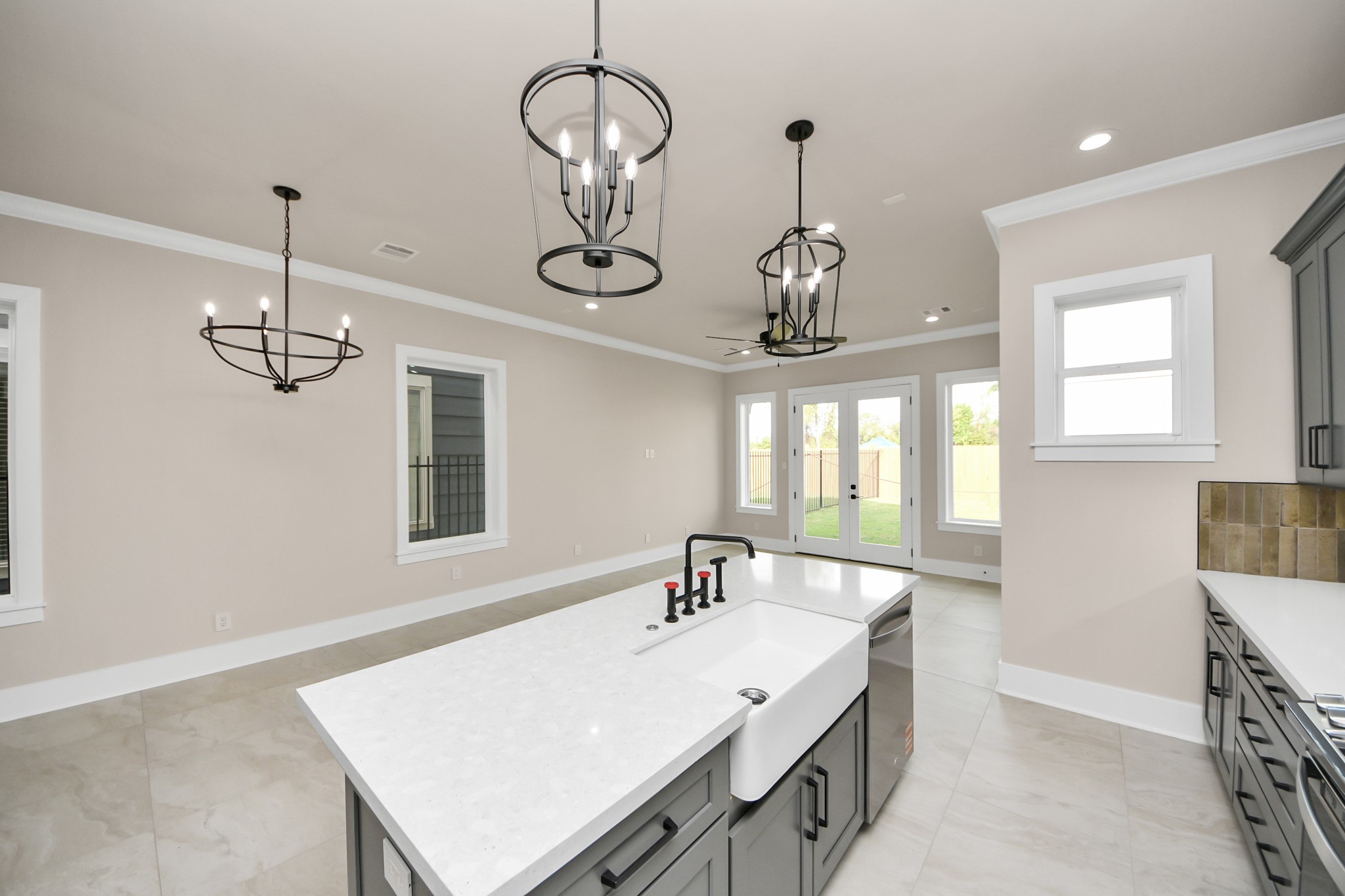 6320 Milwee Street, Unit A Houston, TX 77092 - Photo 16 of 42 a room with a chandelier chandelier and windows