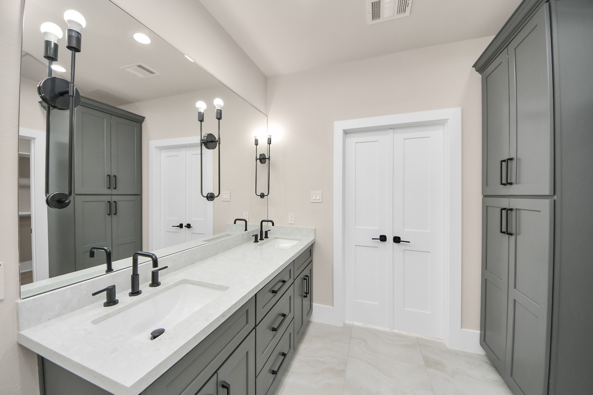 6320 Milwee Street, Unit A Houston, TX 77092 - Photo 24 of 42 a spacious bathroom with a double vanity sink a mirror and shower