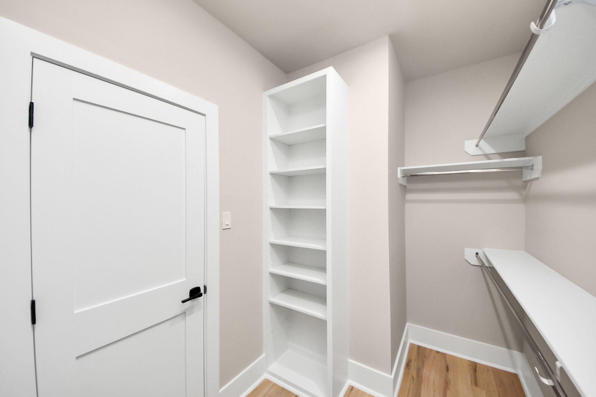 6320 Milwee Street, Unit A Houston, TX 77092 - Photo 26 of 42 a view of walk in closet with empty racks