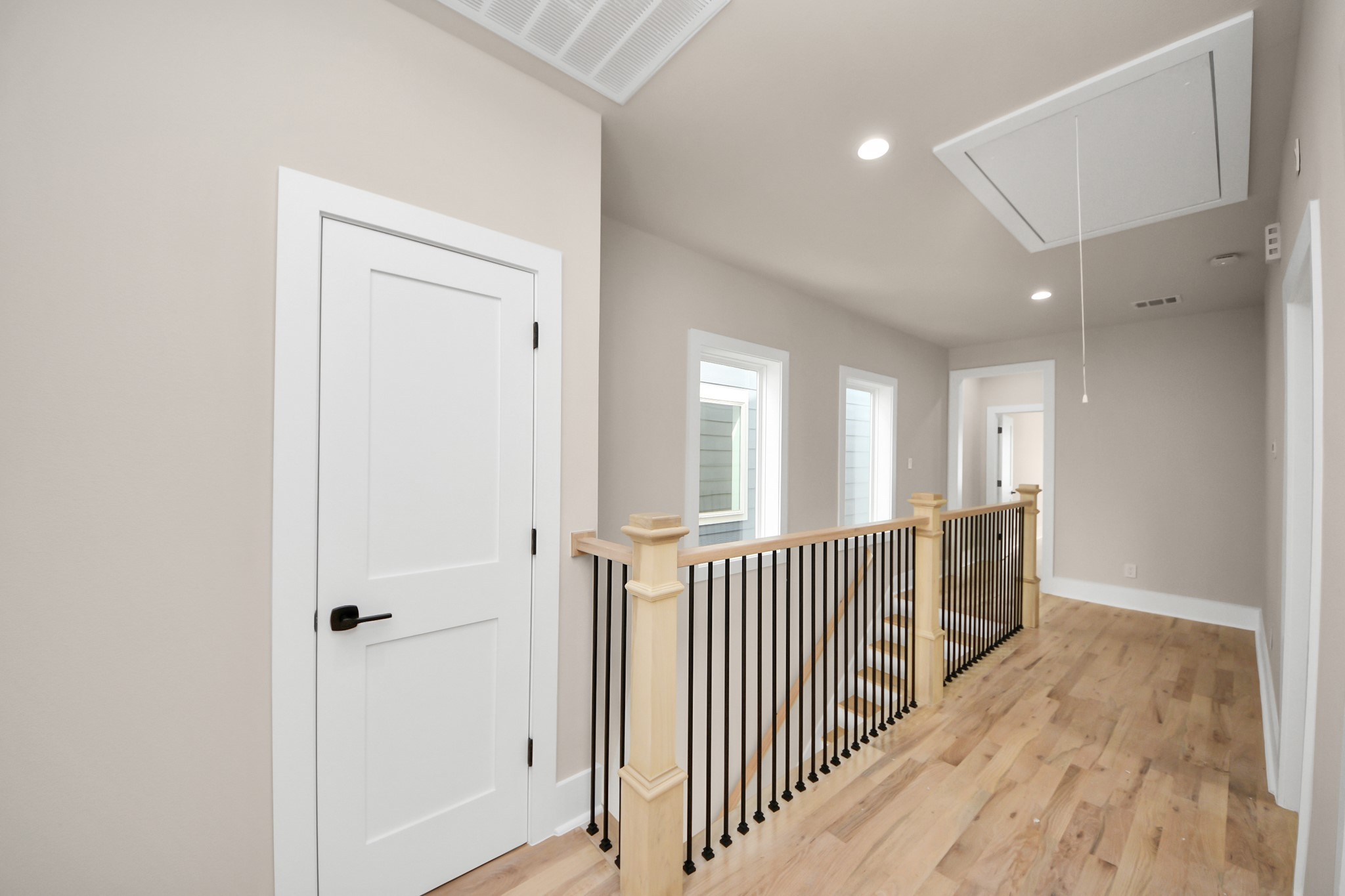 6320 Milwee Street, Unit A Houston, TX 77092 - Photo 29 of 42 a view of a hallway with wooden floor and windows