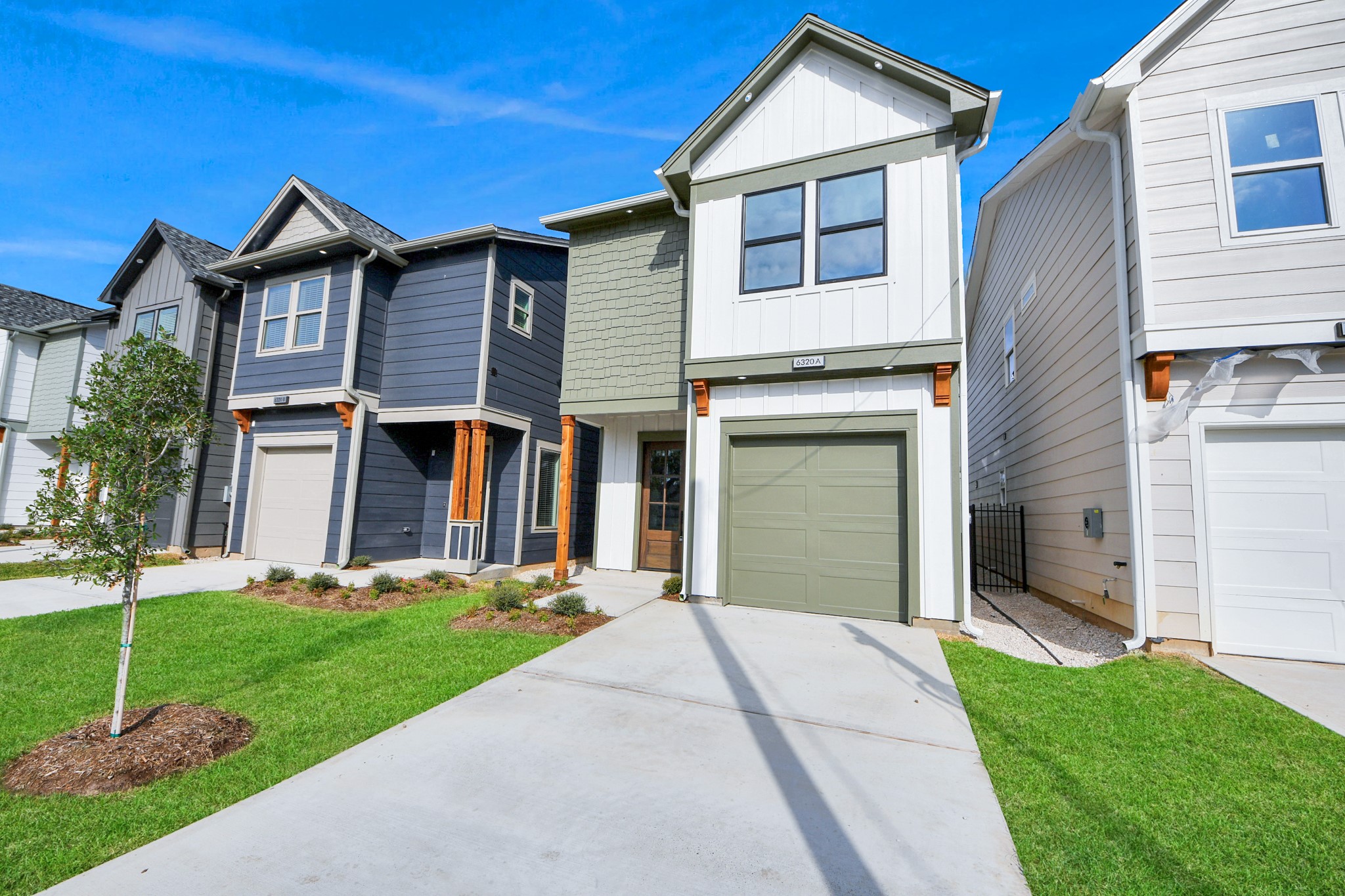 6320 Milwee Street, Unit A Houston, TX 77092 - Photo 3 of 42 a front view of a house with a yard