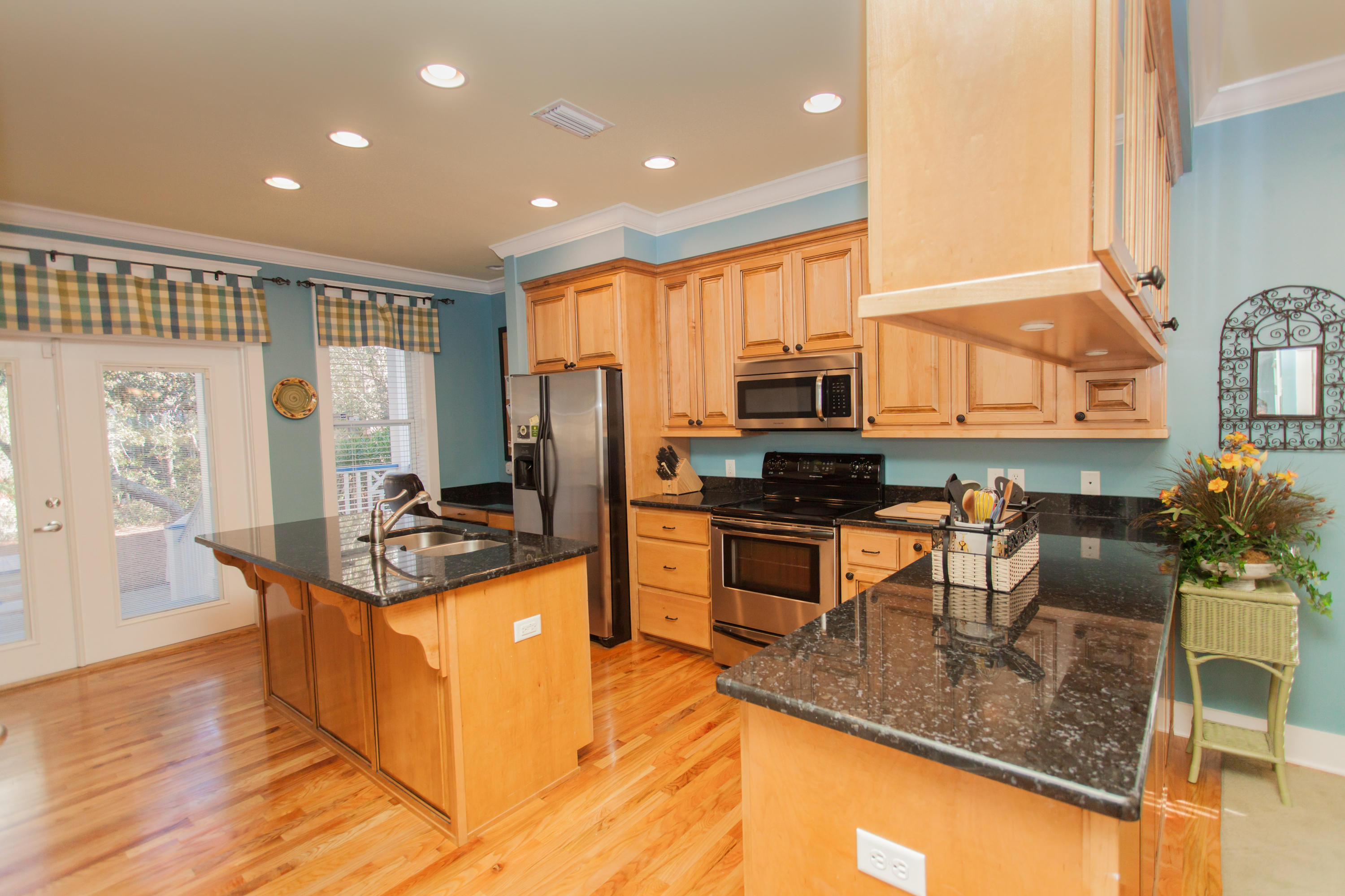 156 Beach Bike Way Inlet Beach, FL 32461 - Photo 21 of 50 a kitchen with stainless steel appliances granite countertop a stove a sink and a microwave