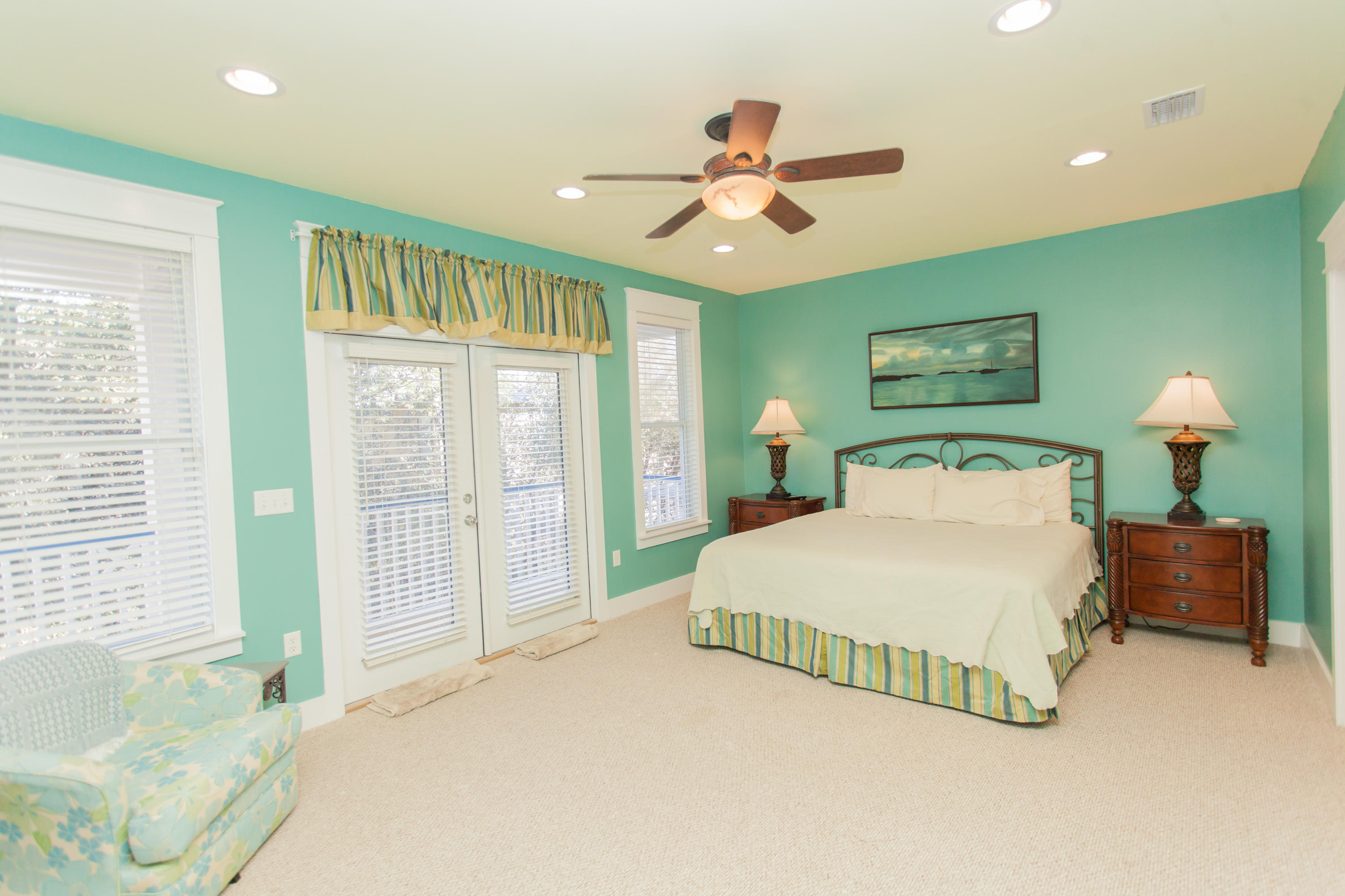 156 Beach Bike Way Inlet Beach, FL 32461 - Photo 32 of 50 a bedroom with a large bed and a chandelier