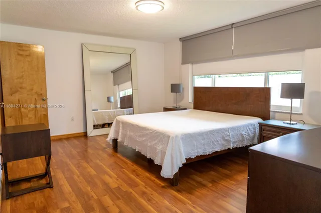 a bedroom with two beds and painted walls