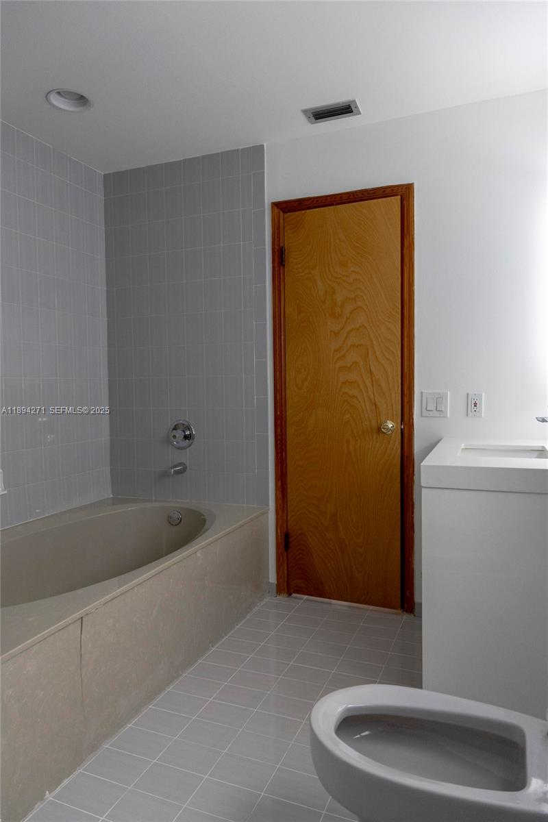8192 Southwest 90th Avenue Miami, FL 33173 - Photo 20 of 31 a bathroom with a bathtub