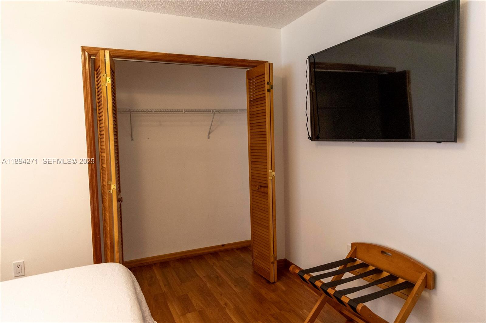 8192 Southwest 90th Avenue Miami, FL 33173 - Photo 25 of 31 a view of a room with wooden floor and cabinet