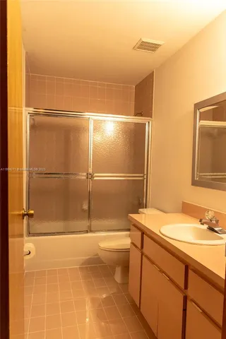 a bathroom with a sink and a shower