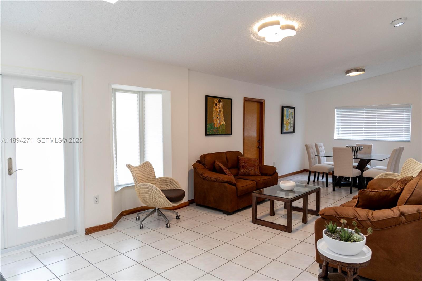 8192 Southwest 90th Avenue Miami, FL 33173 - Photo 3 of 31 a living room with furniture and a window