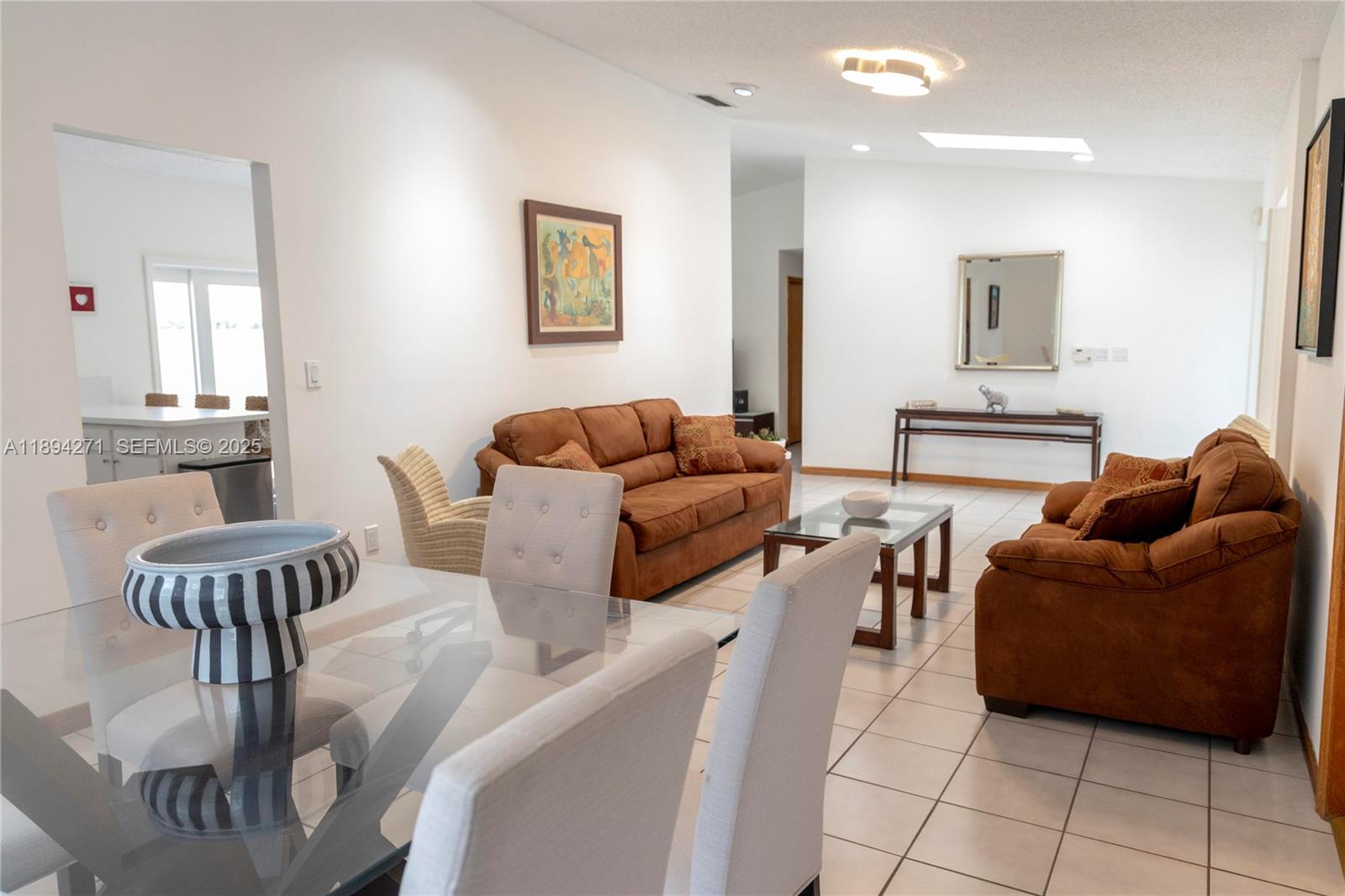 8192 Southwest 90th Avenue Miami, FL 33173 - Photo 5 of 31 a living room with furniture and a table