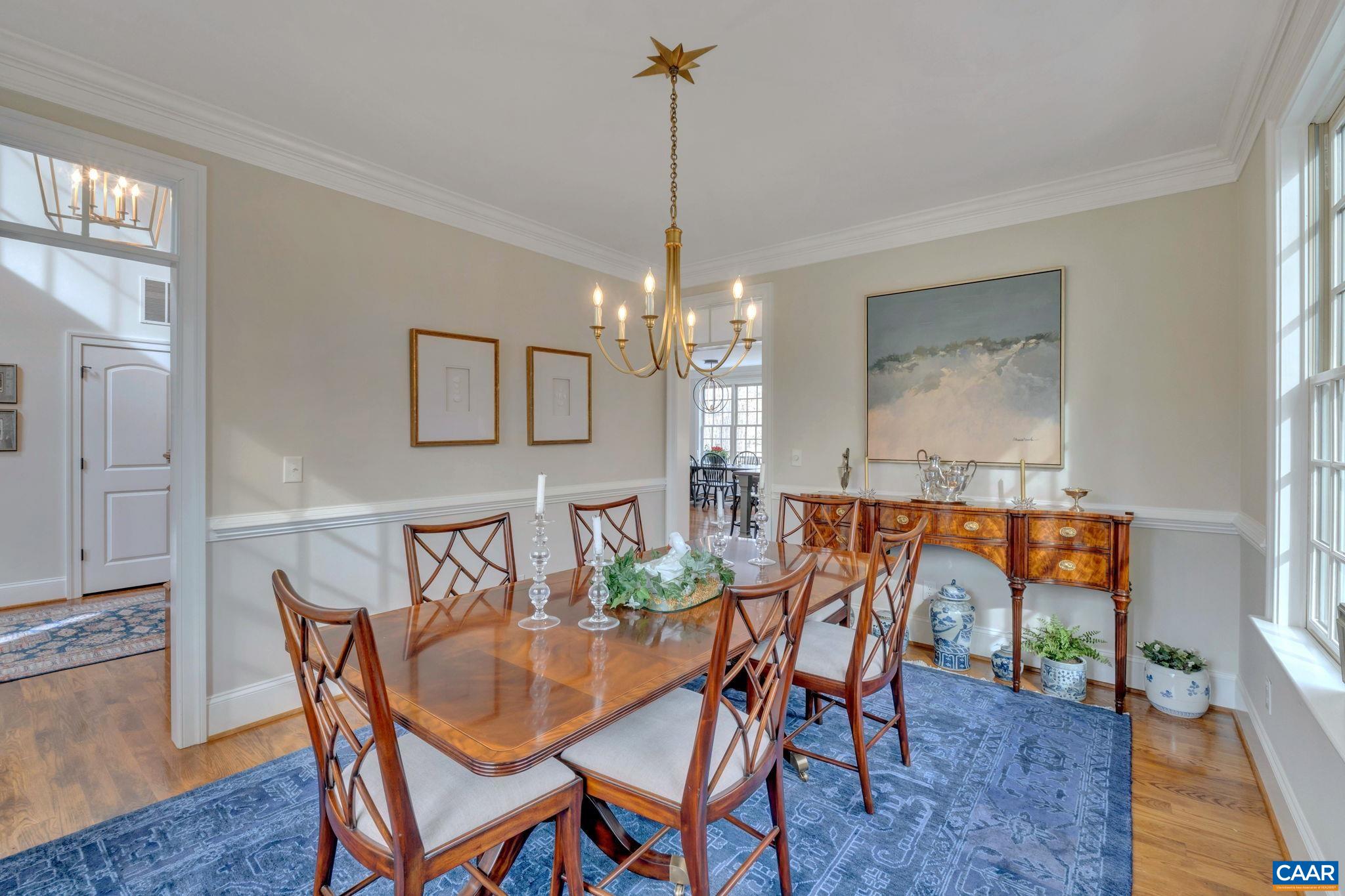 2940 Daventry Lane Charlottesville, VA 22911 - Photo 11 of 67 a dining room with furniture a chandelier and wooden floor