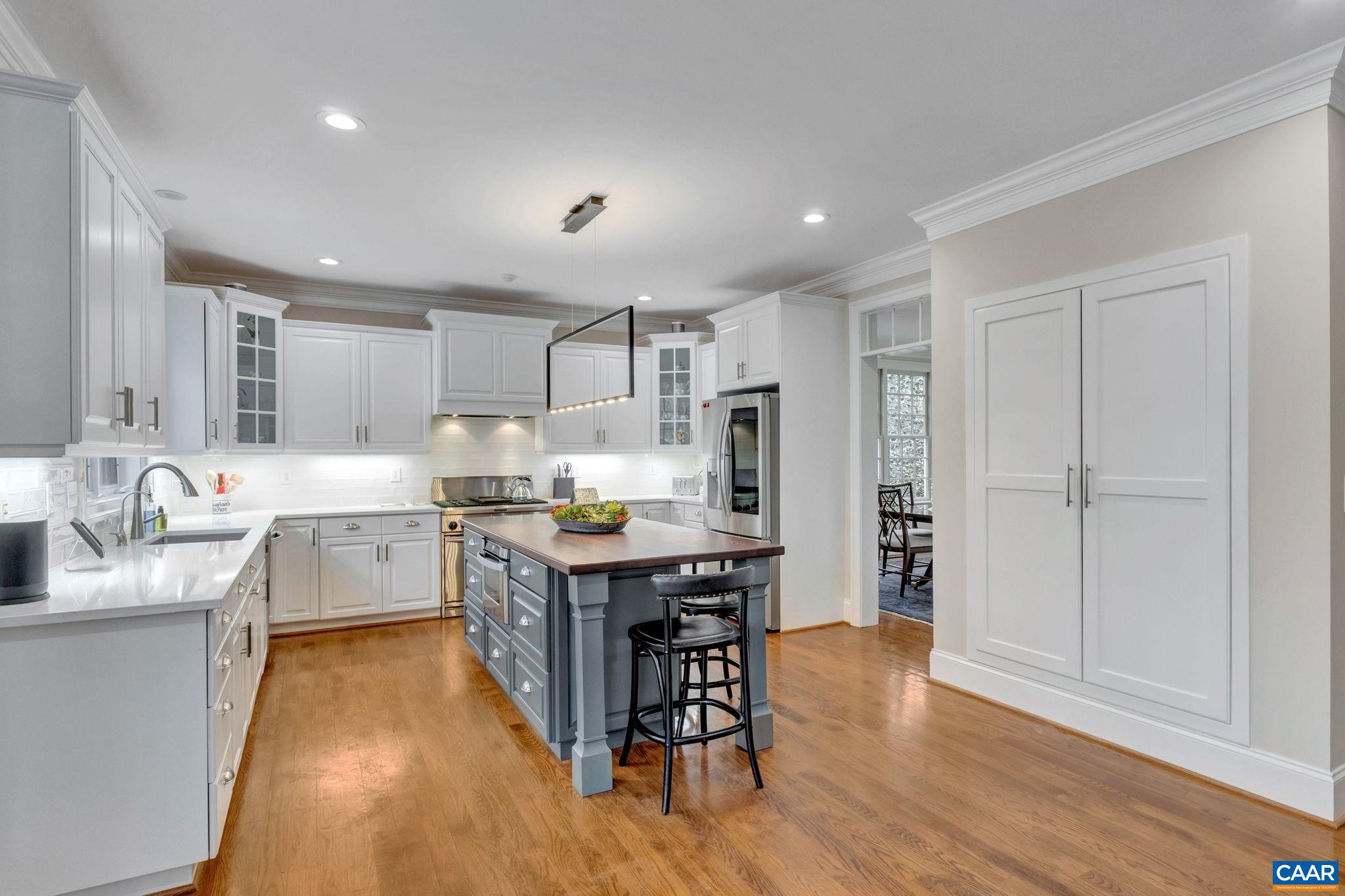 2940 Daventry Lane Charlottesville, VA 22911 - Photo 16 of 67 a kitchen with stainless steel appliances granite countertop a table chairs sink refrigerator and cabinets