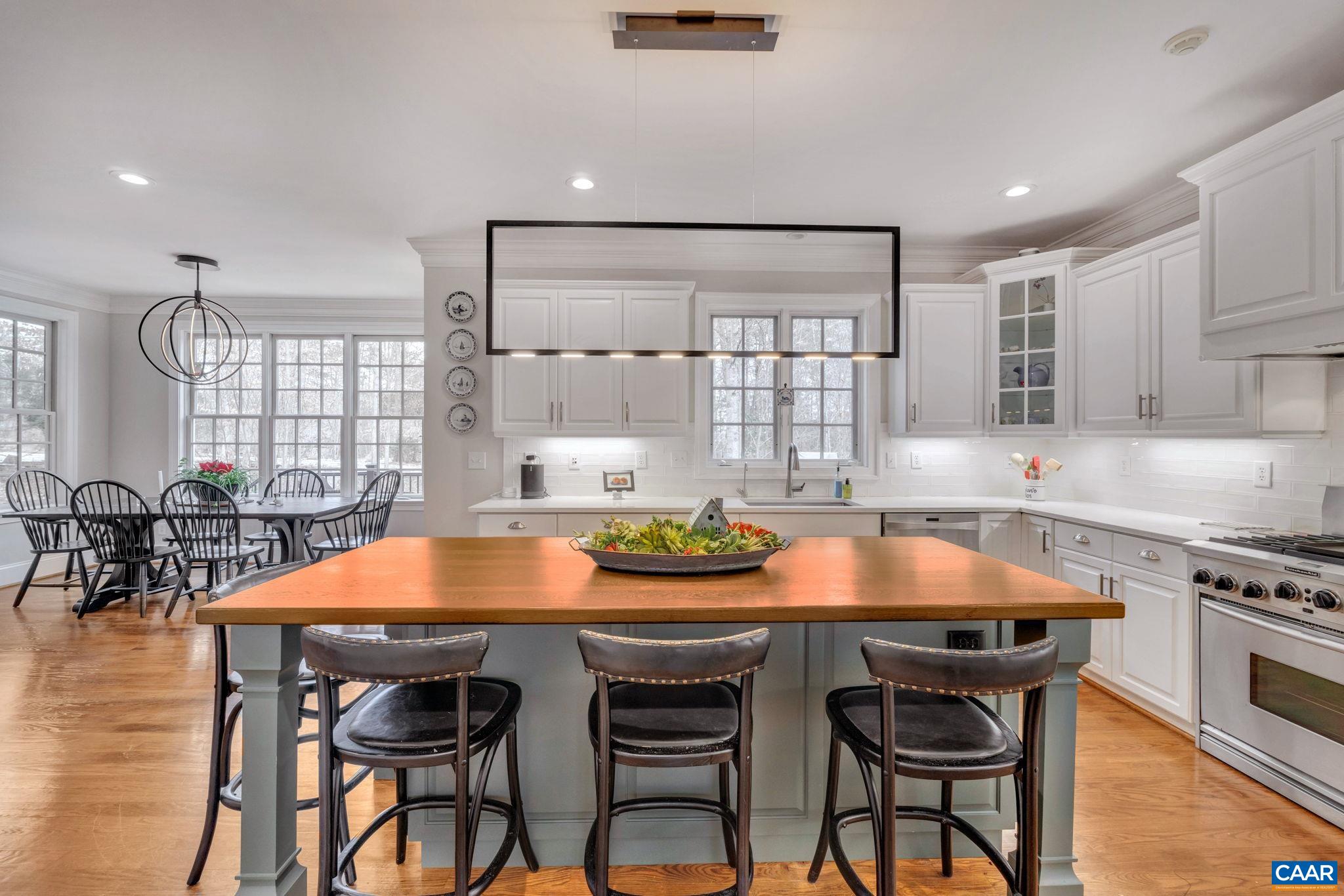 2940 Daventry Lane Charlottesville, VA 22911 - Photo 18 of 67 a view of a dining room with furniture and wooden floor
