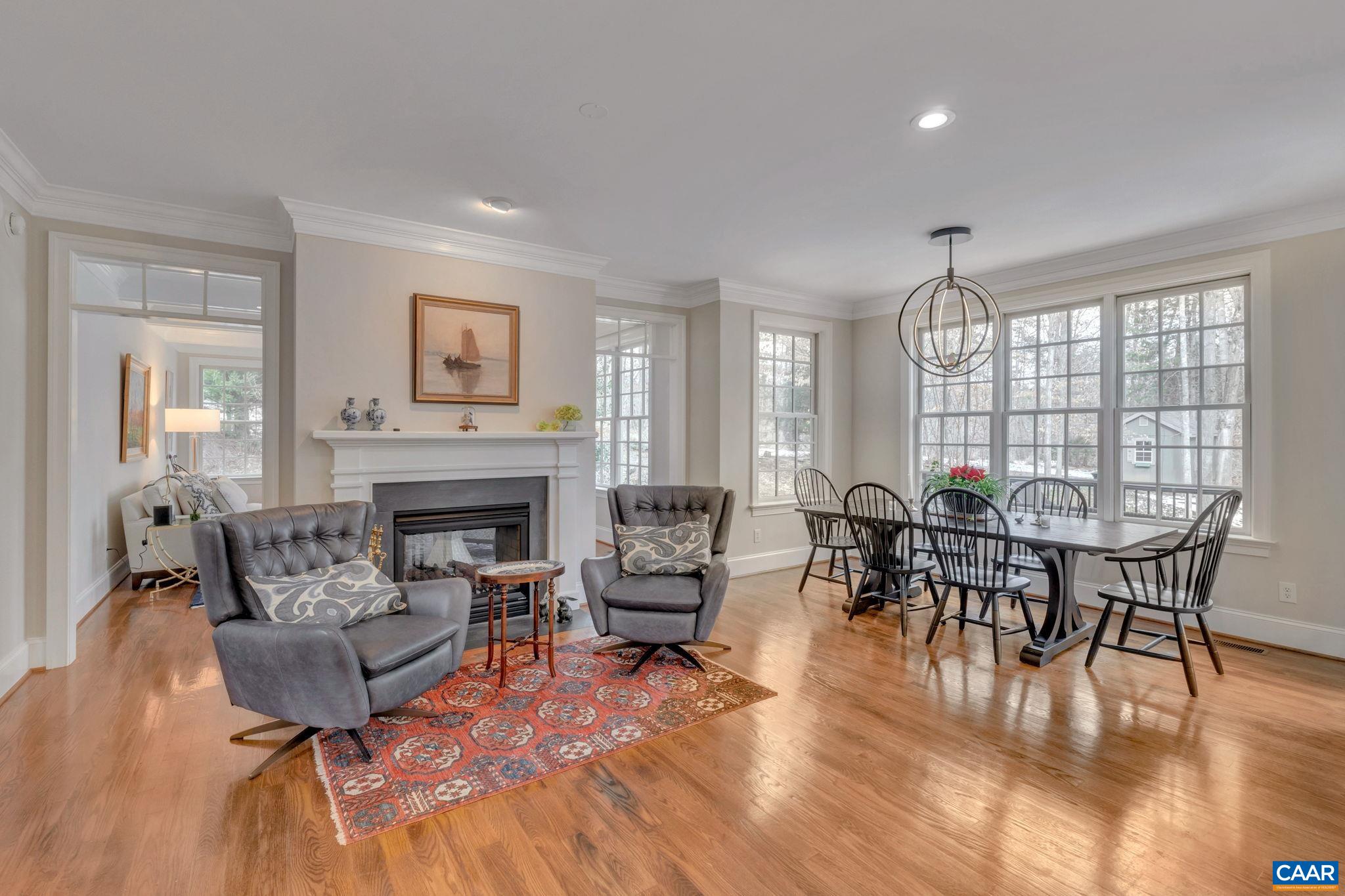2940 Daventry Lane Charlottesville, VA 22911 - Photo 20 of 67 a living room with furniture a fireplace and a large window