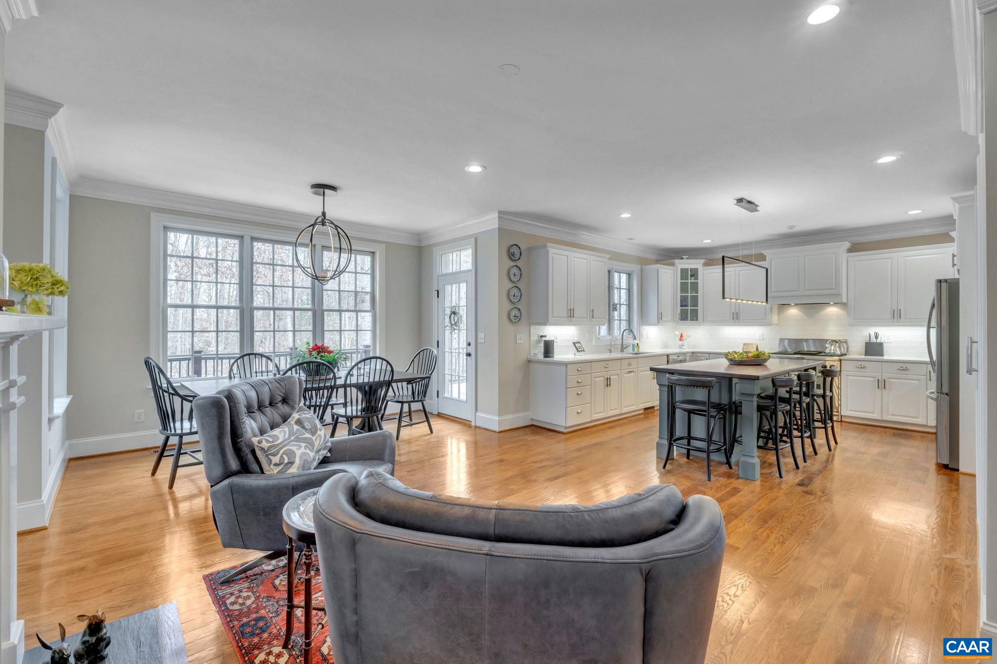 2940 Daventry Lane Charlottesville, VA 22911 - Photo 23 of 67 a living room with furniture a dining table and a large window