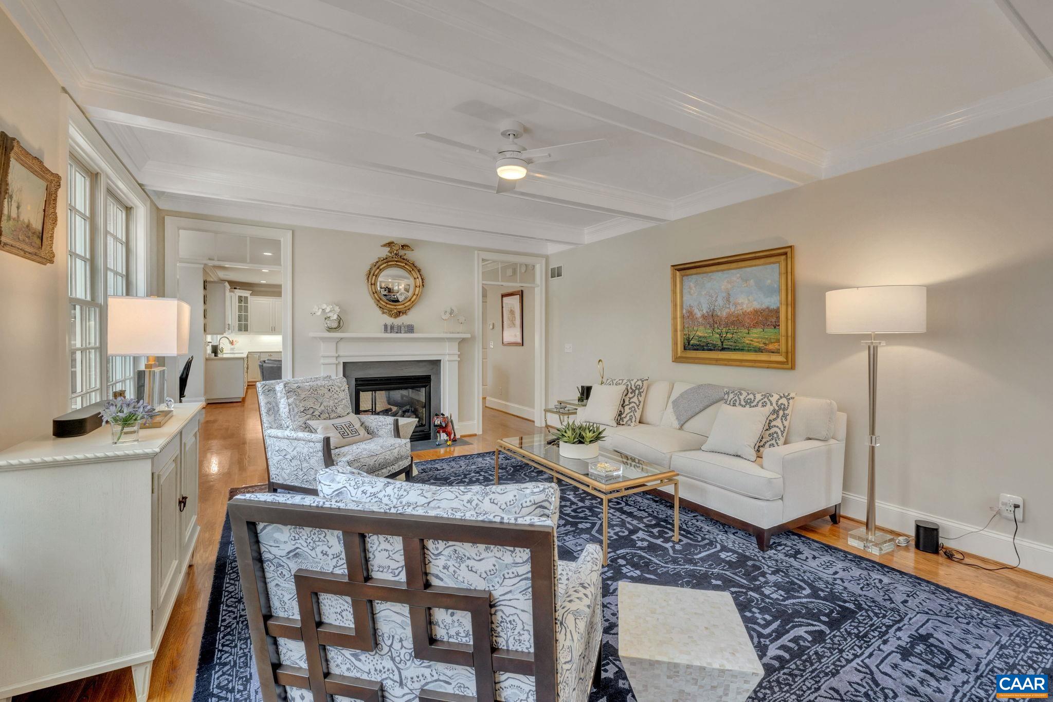 2940 Daventry Lane Charlottesville, VA 22911 - Photo 25 of 67 a living room with furniture a fireplace and a table