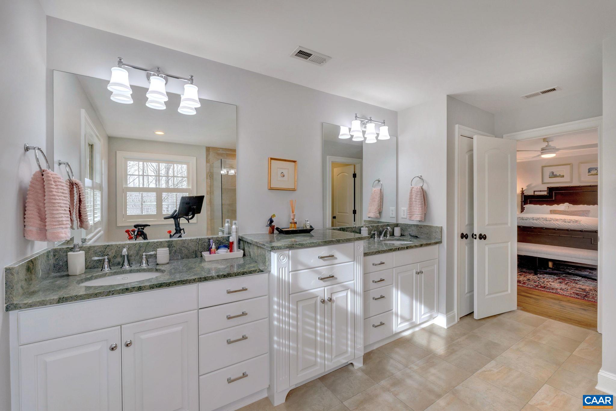 2940 Daventry Lane Charlottesville, VA 22911 - Photo 33 of 67 a spacious bathroom with a granite countertop sink mirror and cabinets