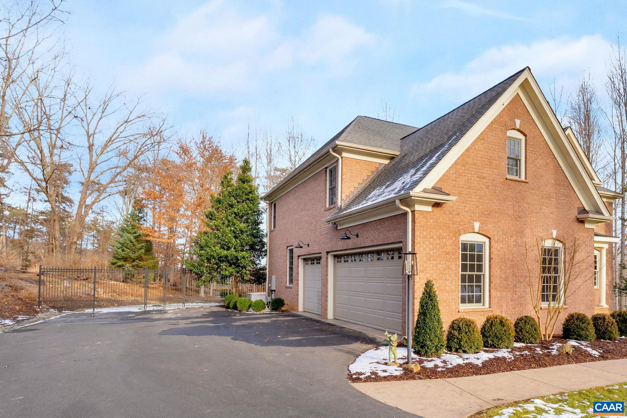 2940 Daventry Lane Charlottesville, VA 22911 - Photo 4 of 67 a front view of a house with a yard and garage