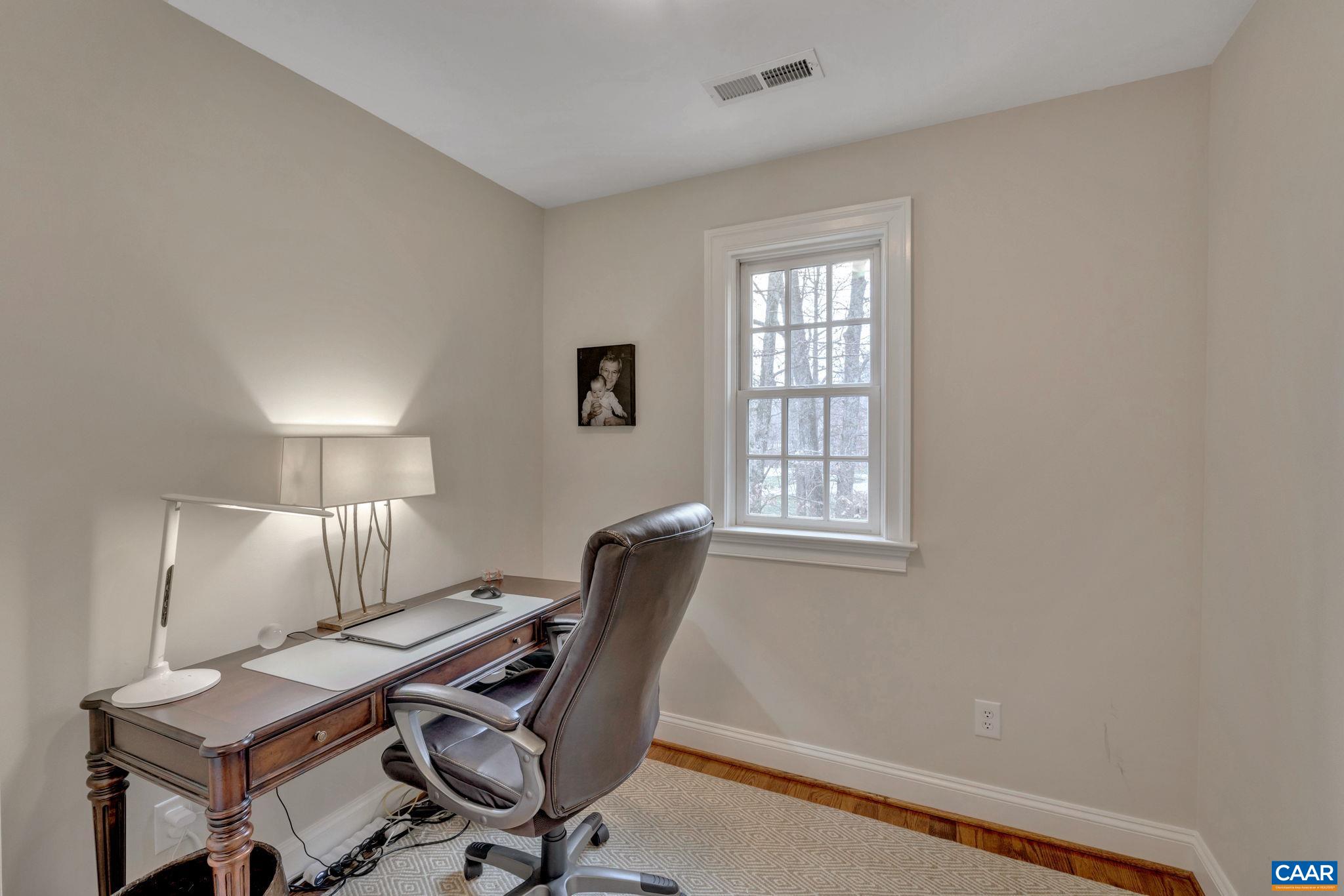 2940 Daventry Lane Charlottesville, VA 22911 - Photo 44 of 67 a view of a workspace with furniture and a window