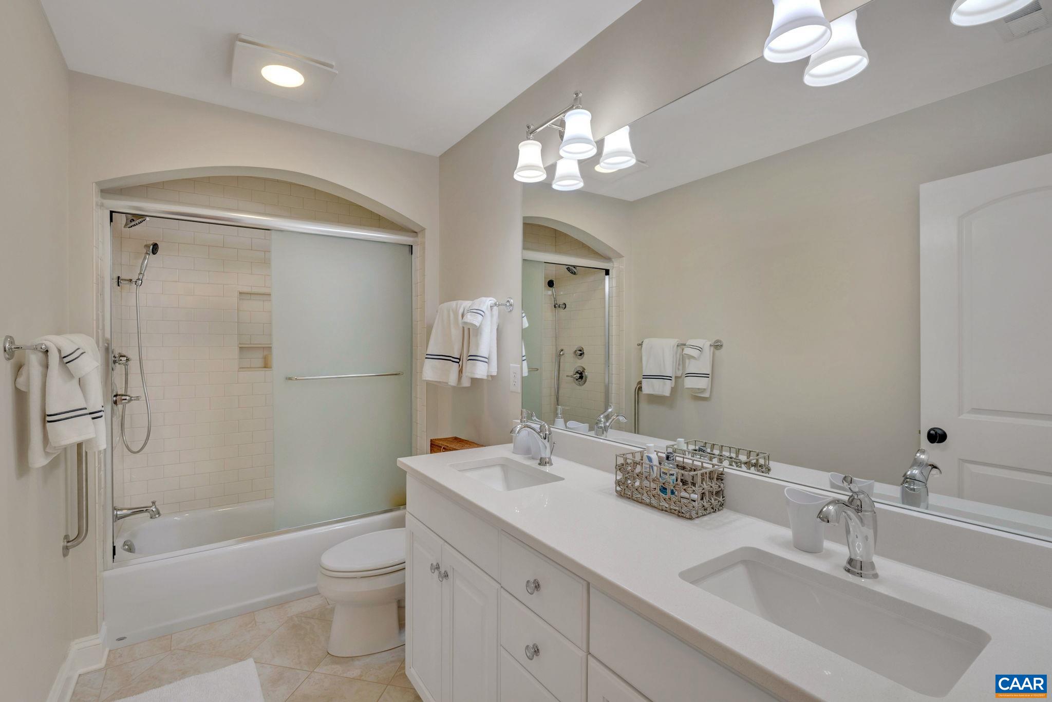 2940 Daventry Lane Charlottesville, VA 22911 - Photo 45 of 67 a bathroom with a sink a toilet and shower