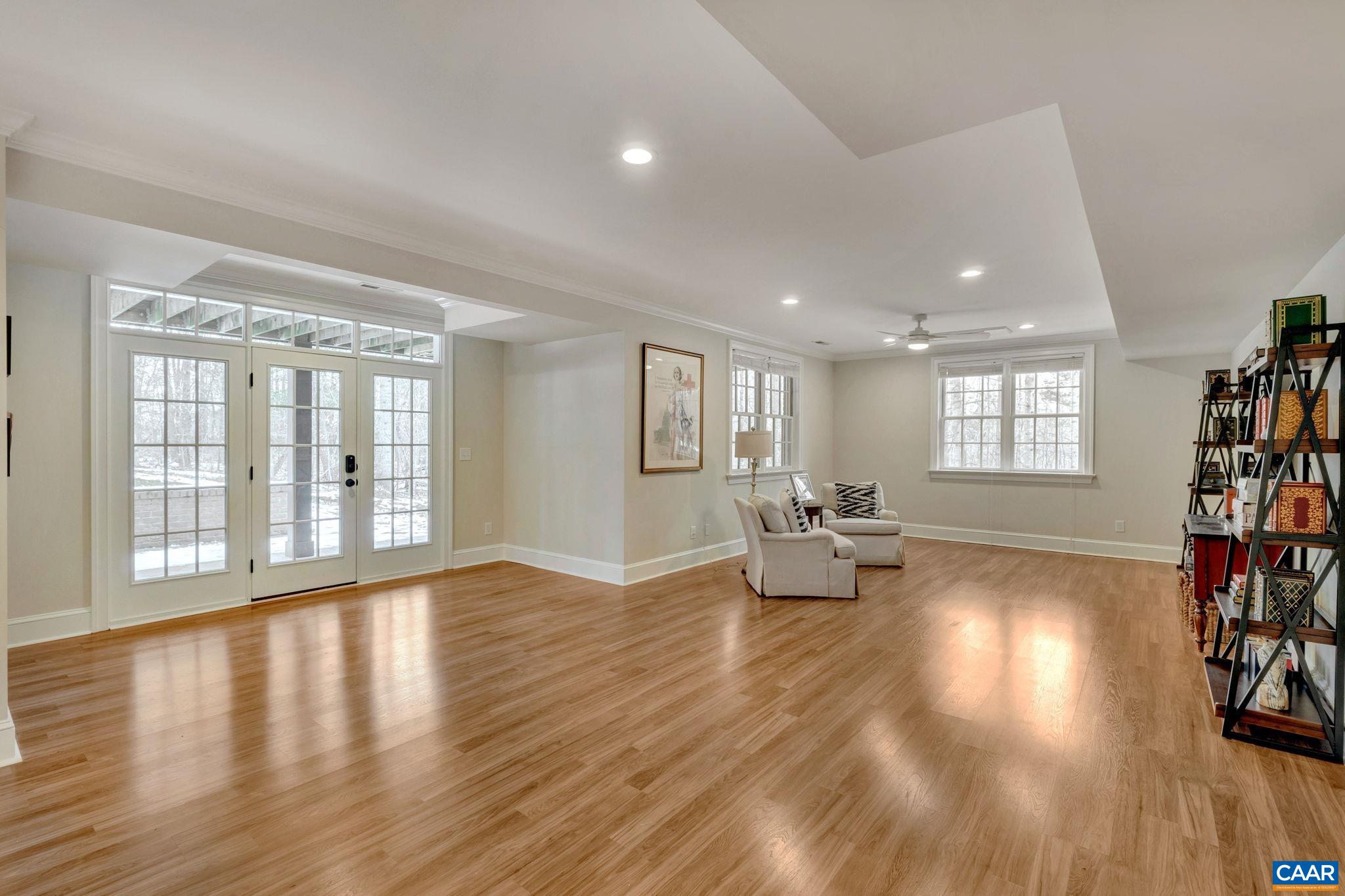 2940 Daventry Lane Charlottesville, VA 22911 - Photo 49 of 67 a view of an empty room with wooden floor and a window