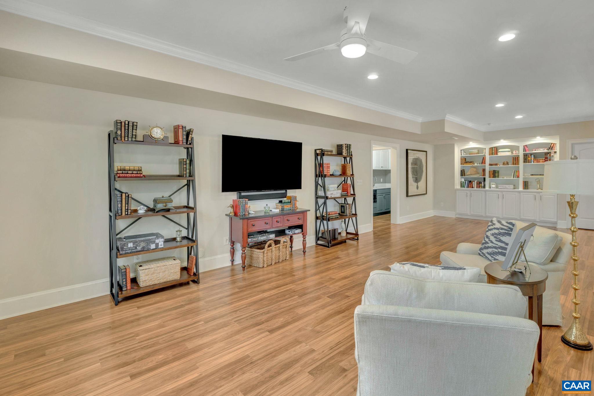 2940 Daventry Lane Charlottesville, VA 22911 - Photo 50 of 67 a living room with furniture and a flat screen tv