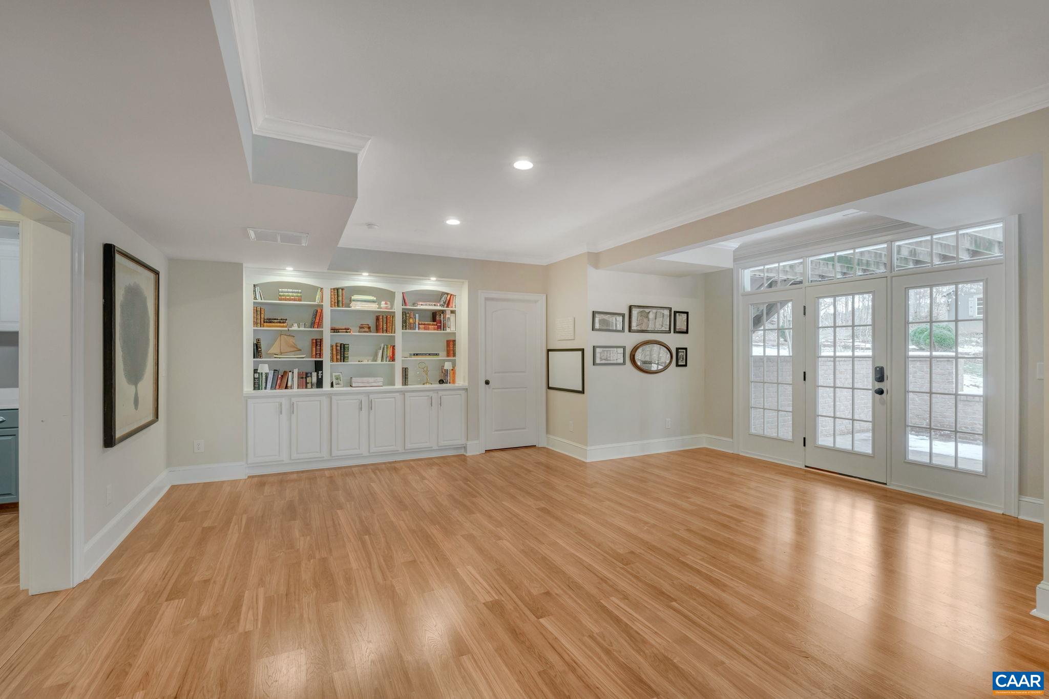 2940 Daventry Lane Charlottesville, VA 22911 - Photo 51 of 67 a view of an empty room with a window and wooden floor