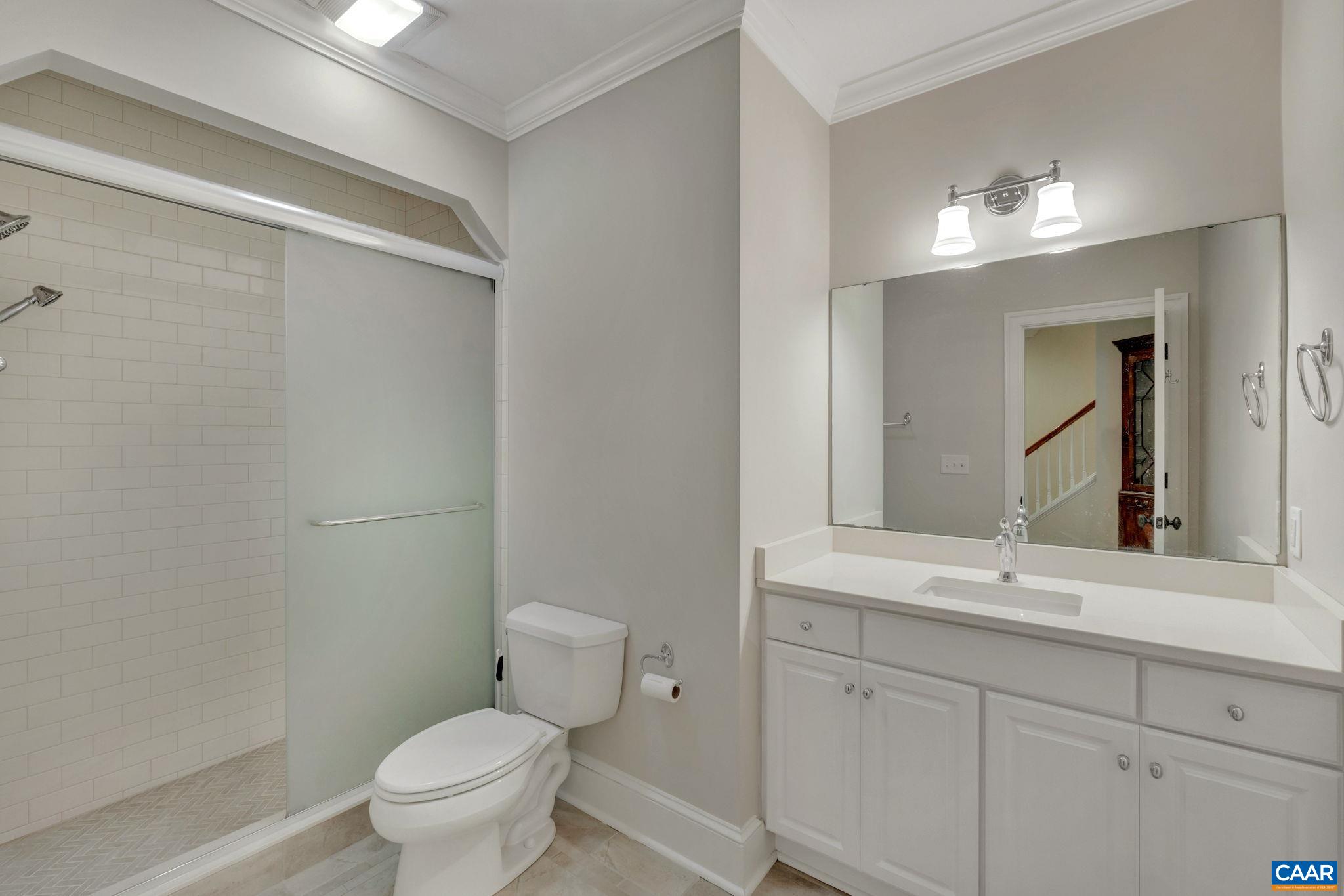 2940 Daventry Lane Charlottesville, VA 22911 - Photo 55 of 67 a bathroom with a toilet sink and mirror