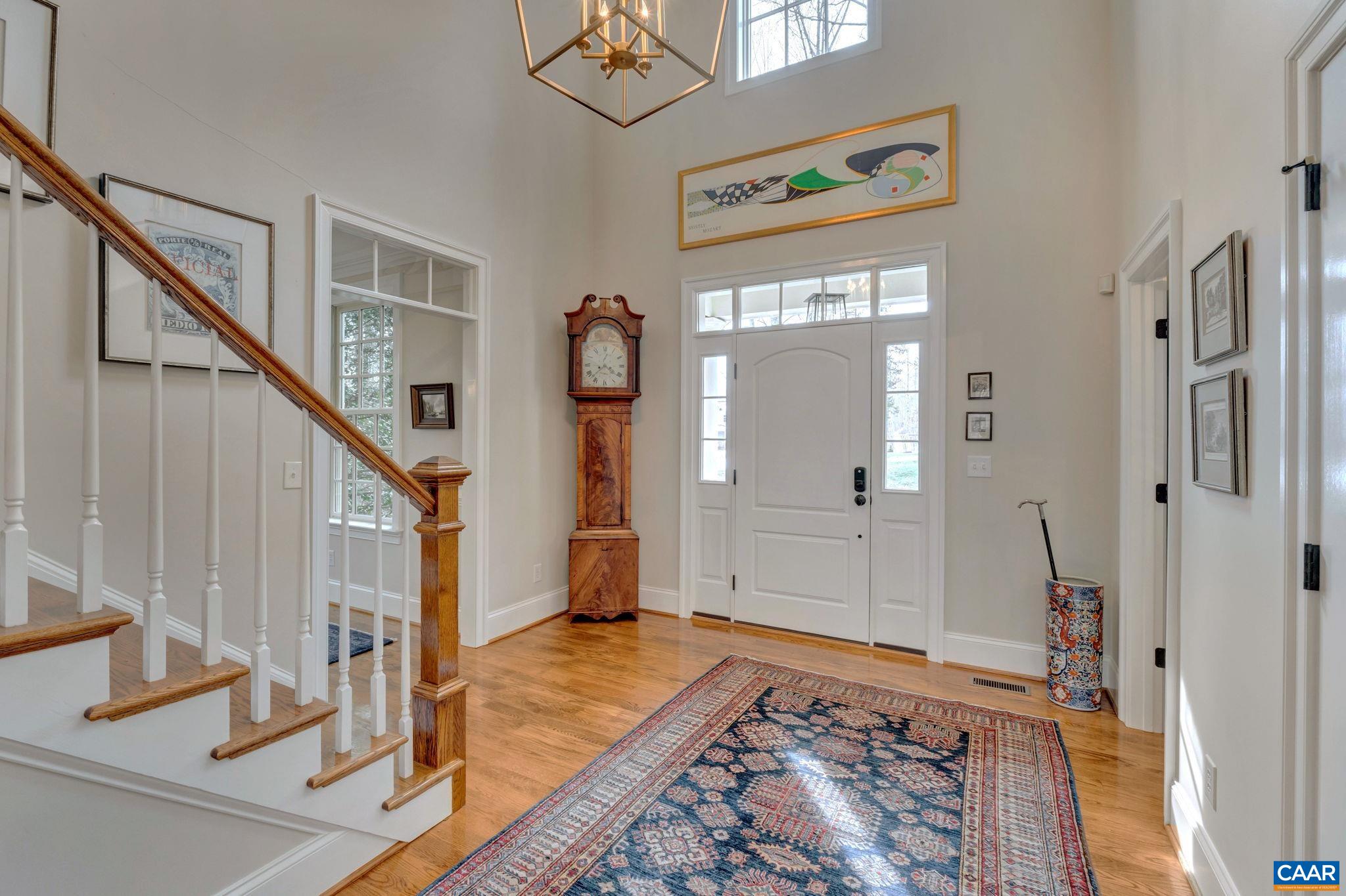 2940 Daventry Lane Charlottesville, VA 22911 - Photo 7 of 67 a view of an entryway with wooden floor and a livingroom