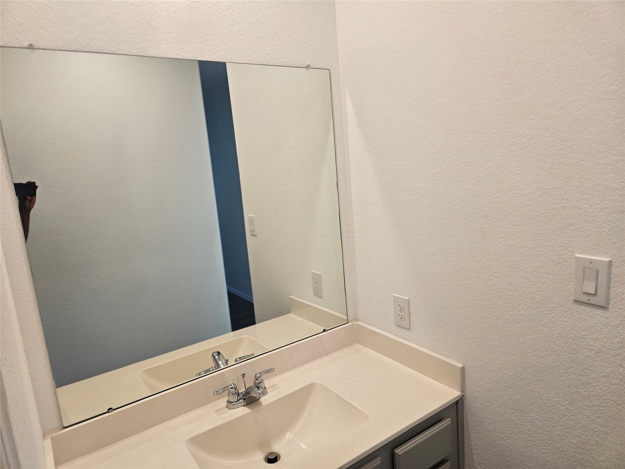 4926 Lenox Grv Lane Rosharon, TX 77583 - Photo 18 of 26 a bathroom with a sink and a mirror