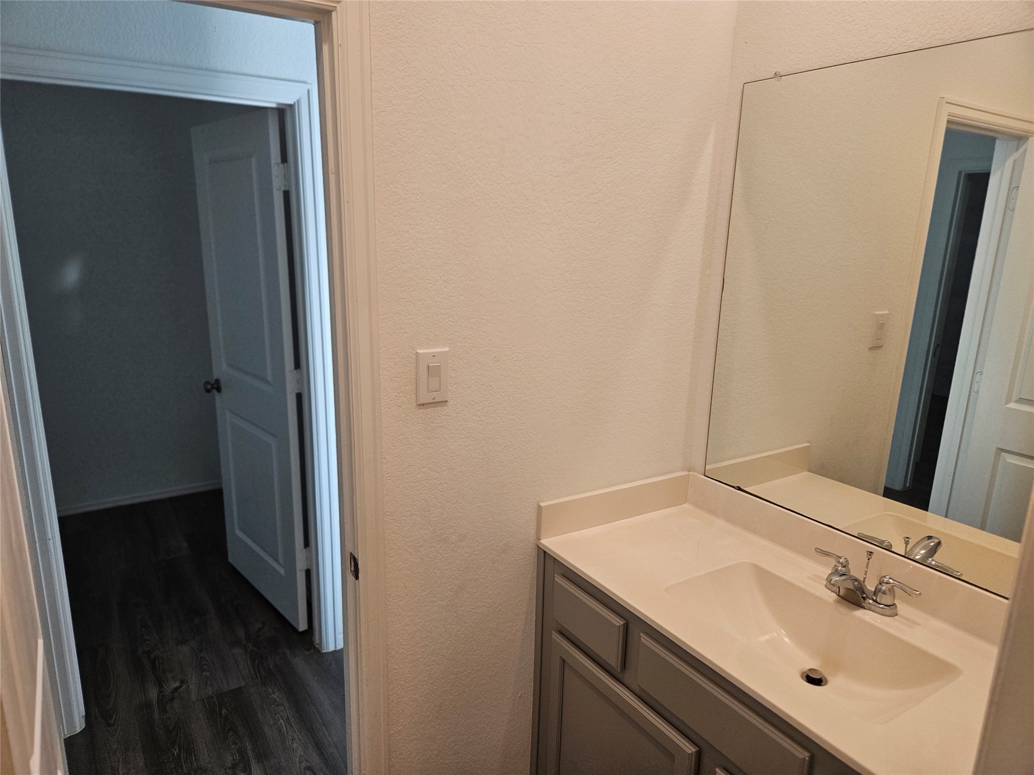 4926 Lenox Grv Lane Rosharon, TX 77583 - Photo 20 of 26 a bathroom with a sink and a mirror