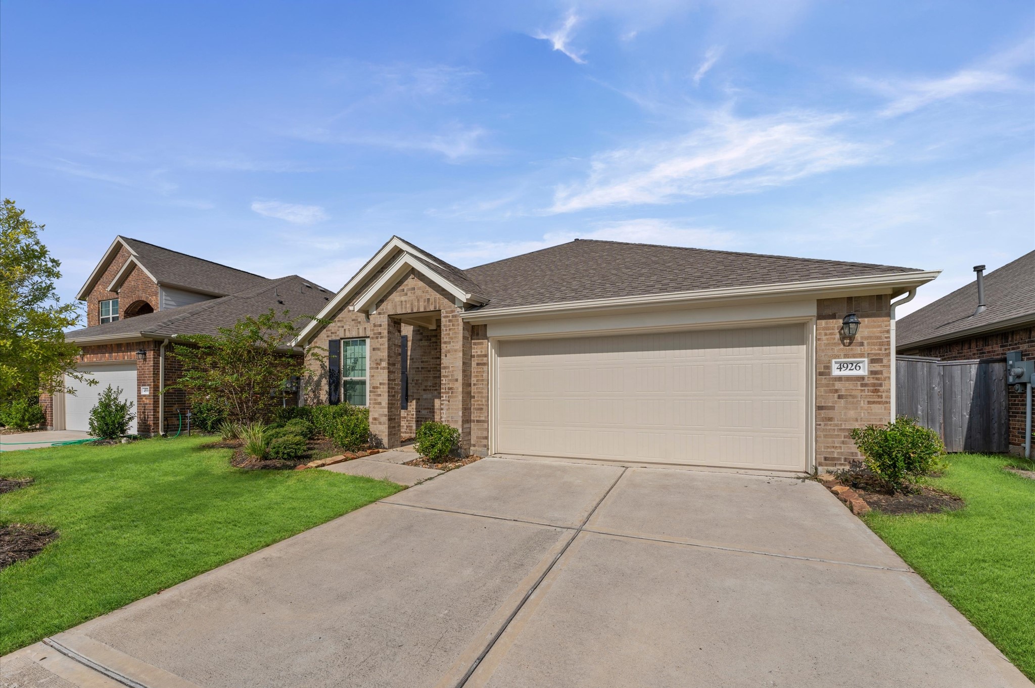 4926 Lenox Grv Lane Rosharon, TX 77583 - Photo 2 of 26 a front view of house with yard and green space