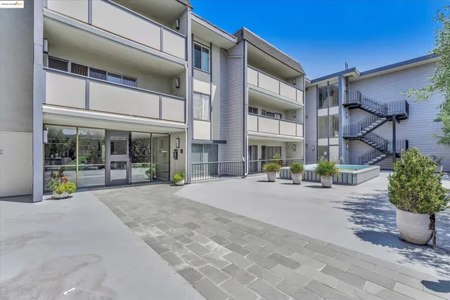 a view of a building with sitting area